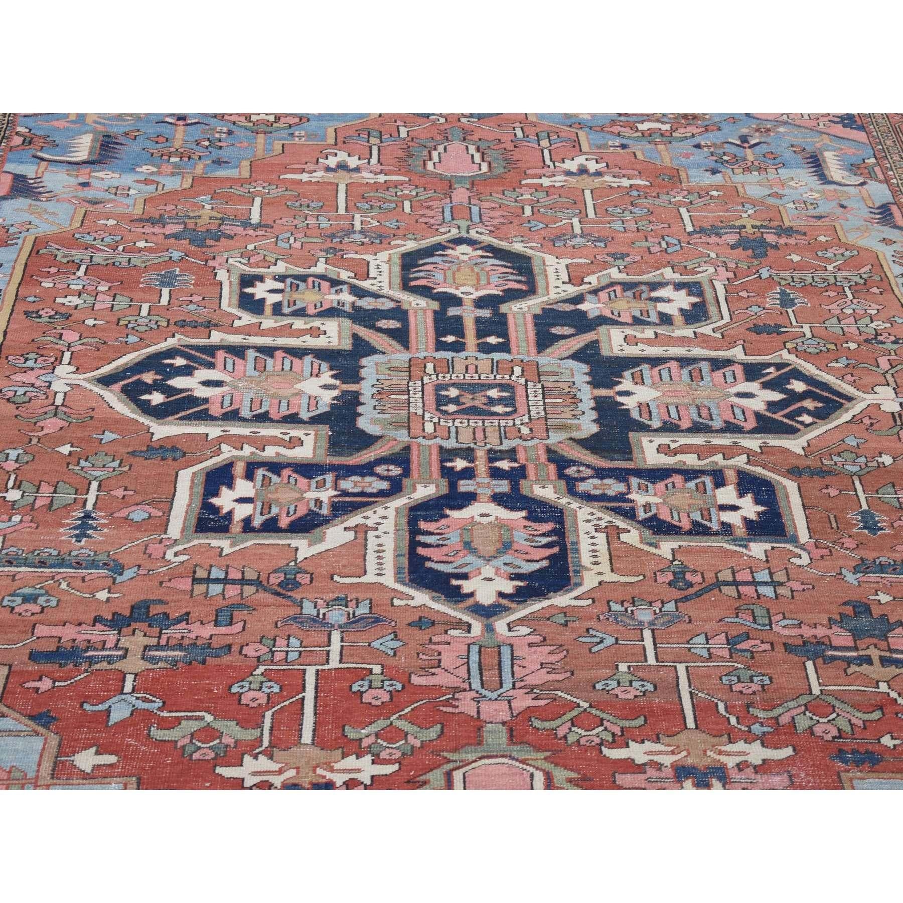 Late 19th Century Red with Light Blue Corners Antique Persian Serapi Heriz Hand Knotted Wool Rug For Sale