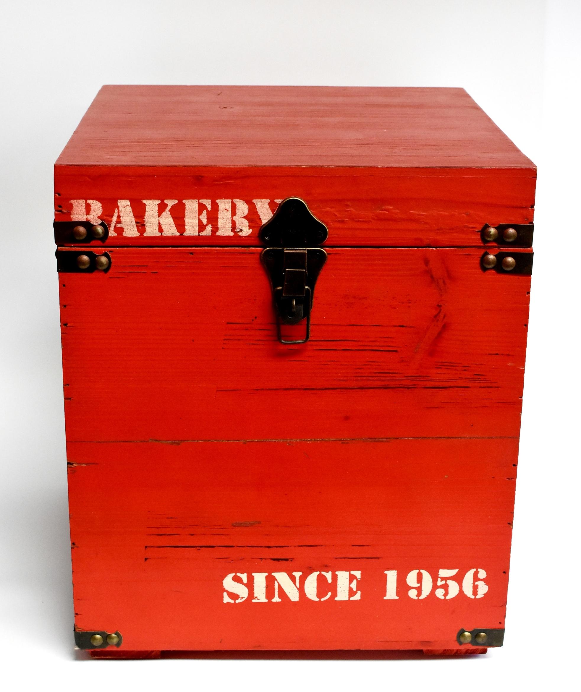 A brand new wooden box painted in beautiful red color. White stenciled 