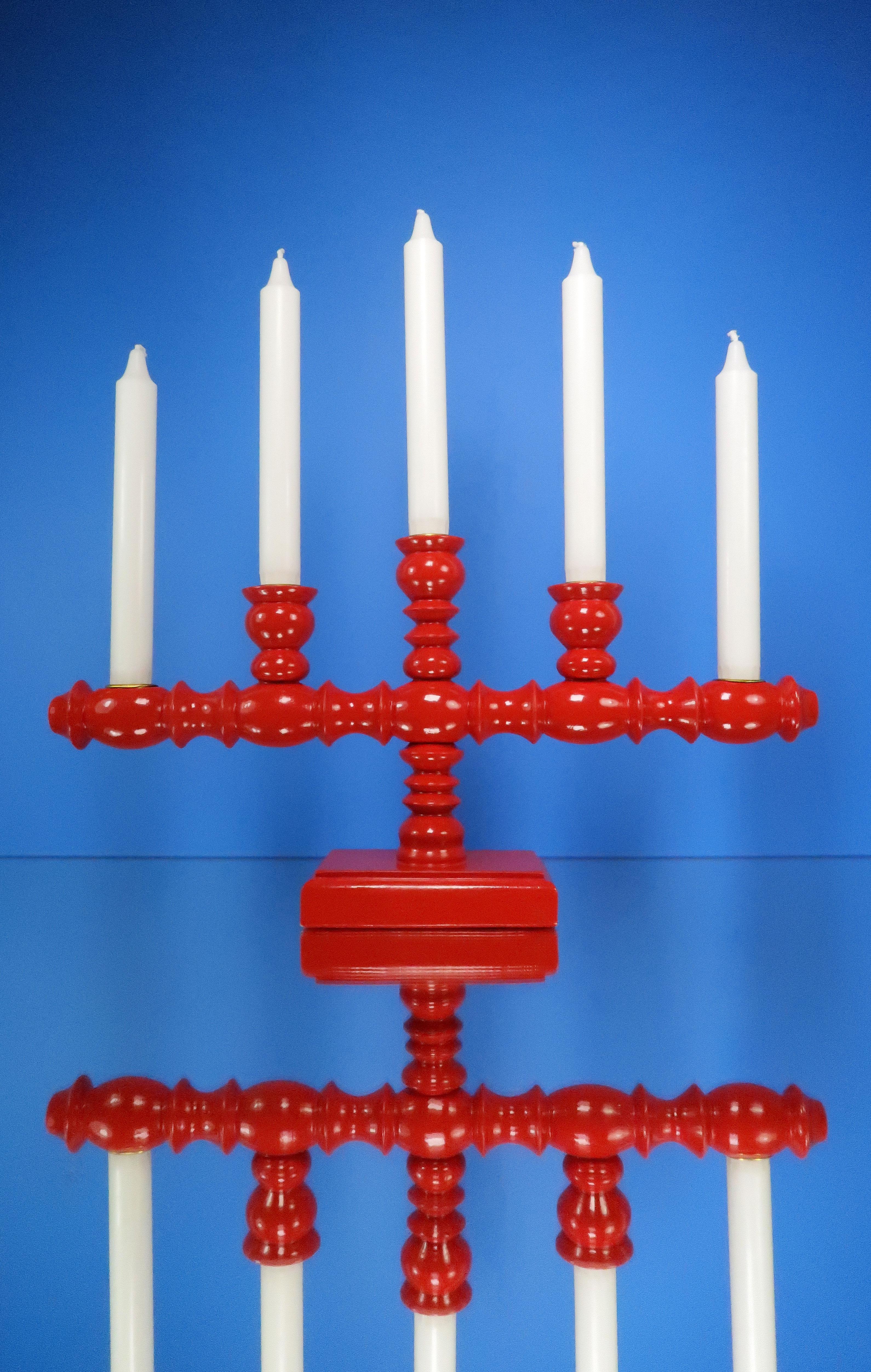 Beautiful Scandinavian modern handmade wooden candelabra for five candles. Original glossy red with golden colored insert in each holder. Beautiful vintage condition.