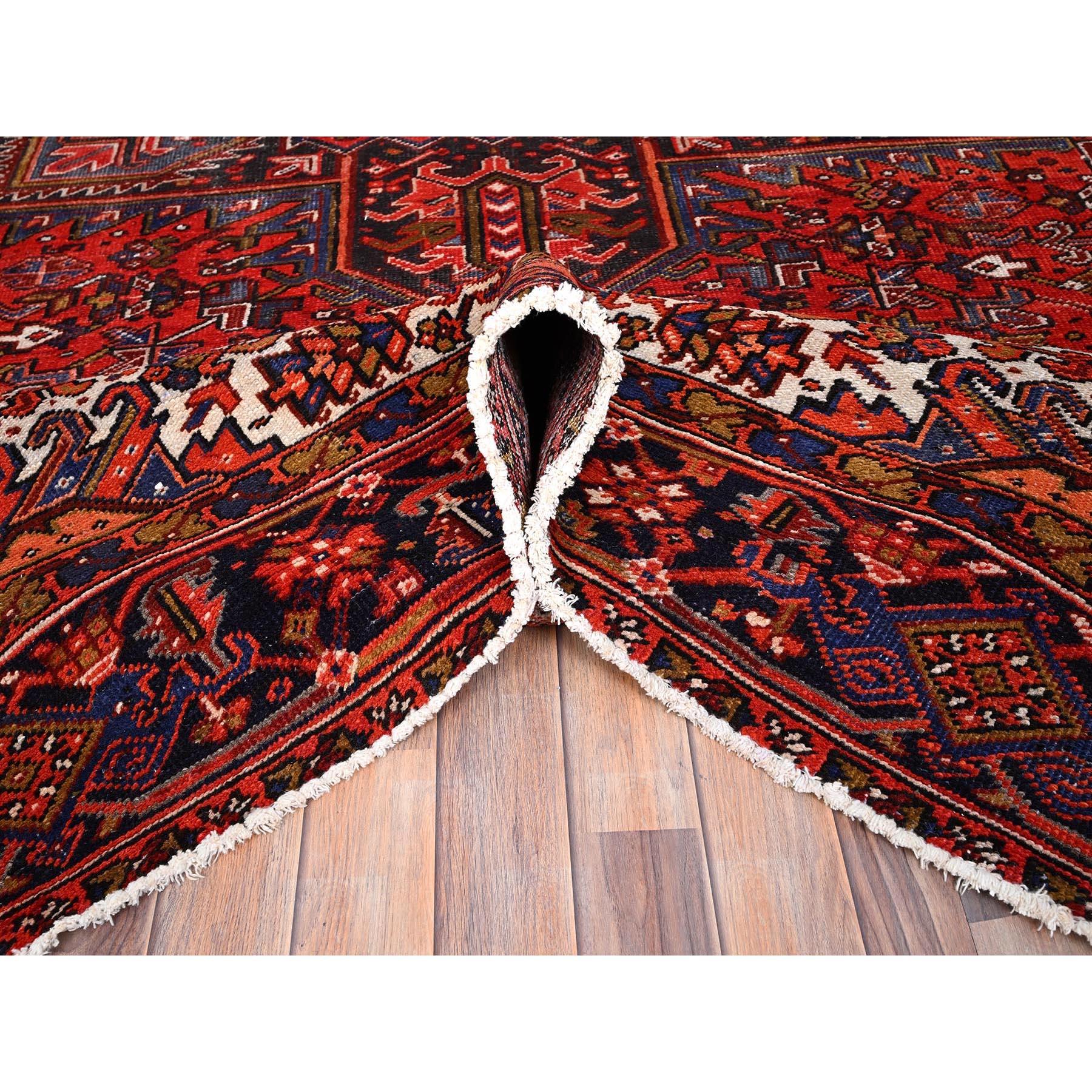 Mid-20th Century Red Wool Hand Knotted Vintage Persian Heriz Village Motif Rustic Look Rug For Sale