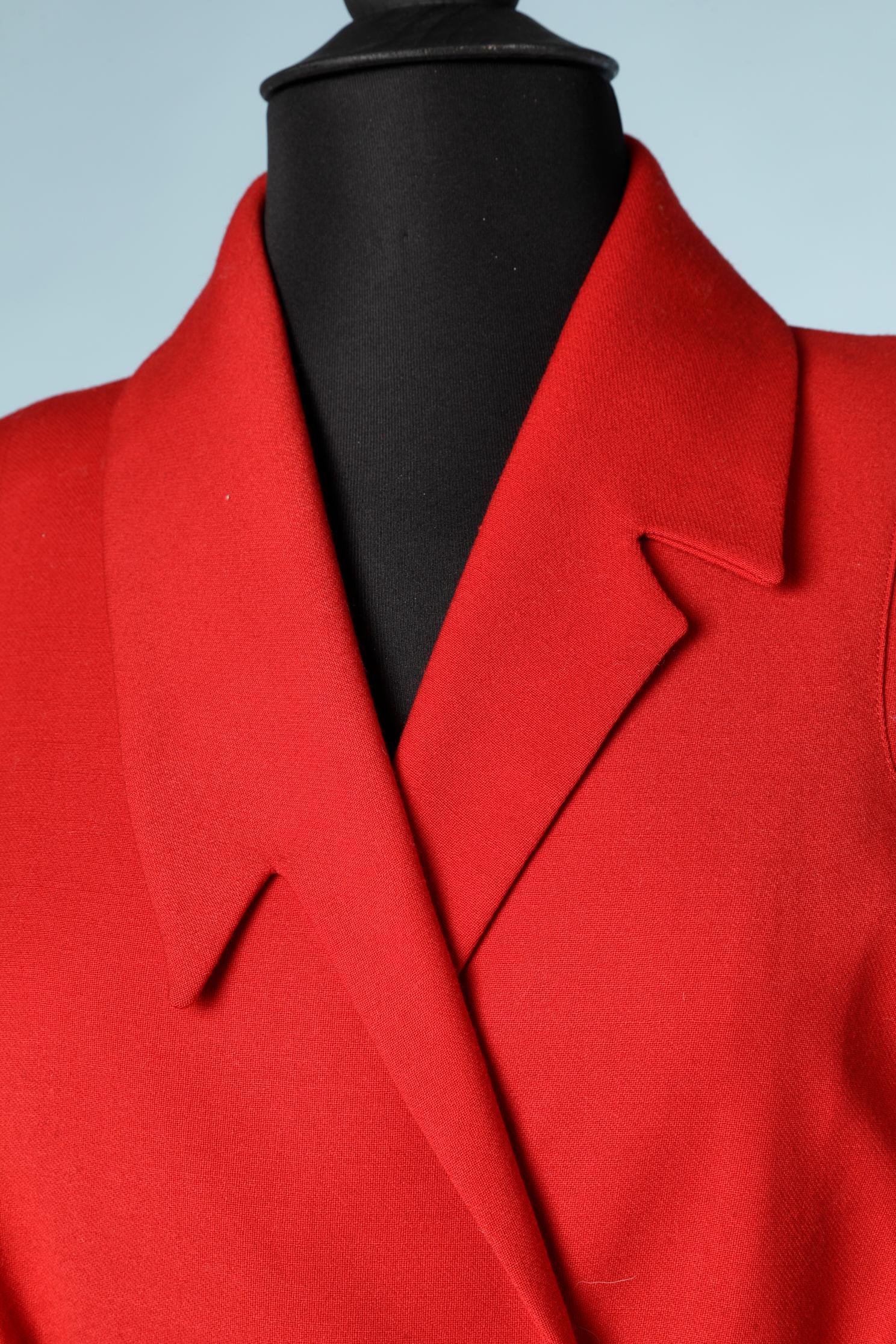 Red wool jacket with asymmetrical collar and silver buckles belt.
Size: 42 ( Fr)  12 (Us)