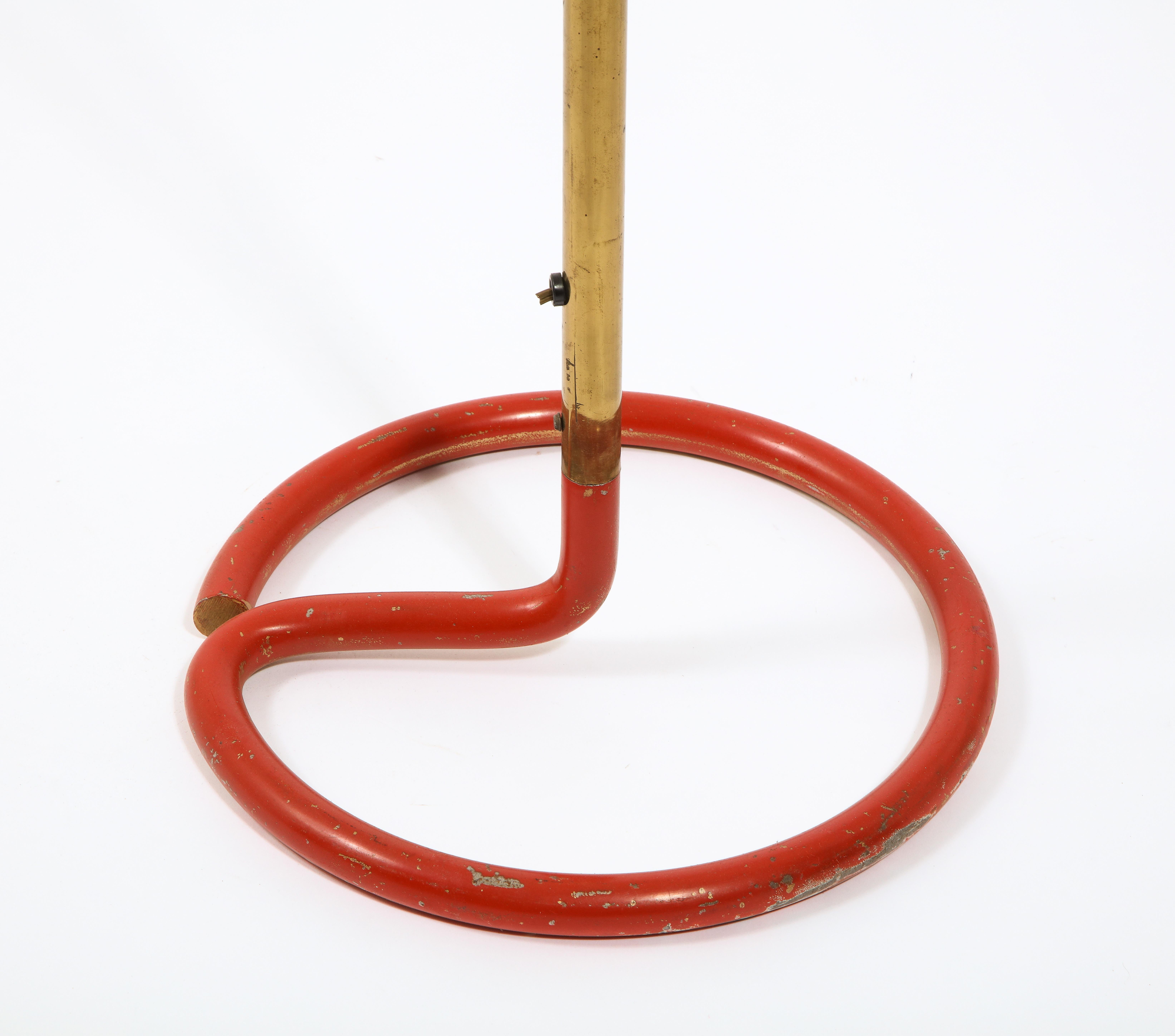 Whimsical floor lamp with a coiled wrought-iron base enameled red and brass stem. Stamped 