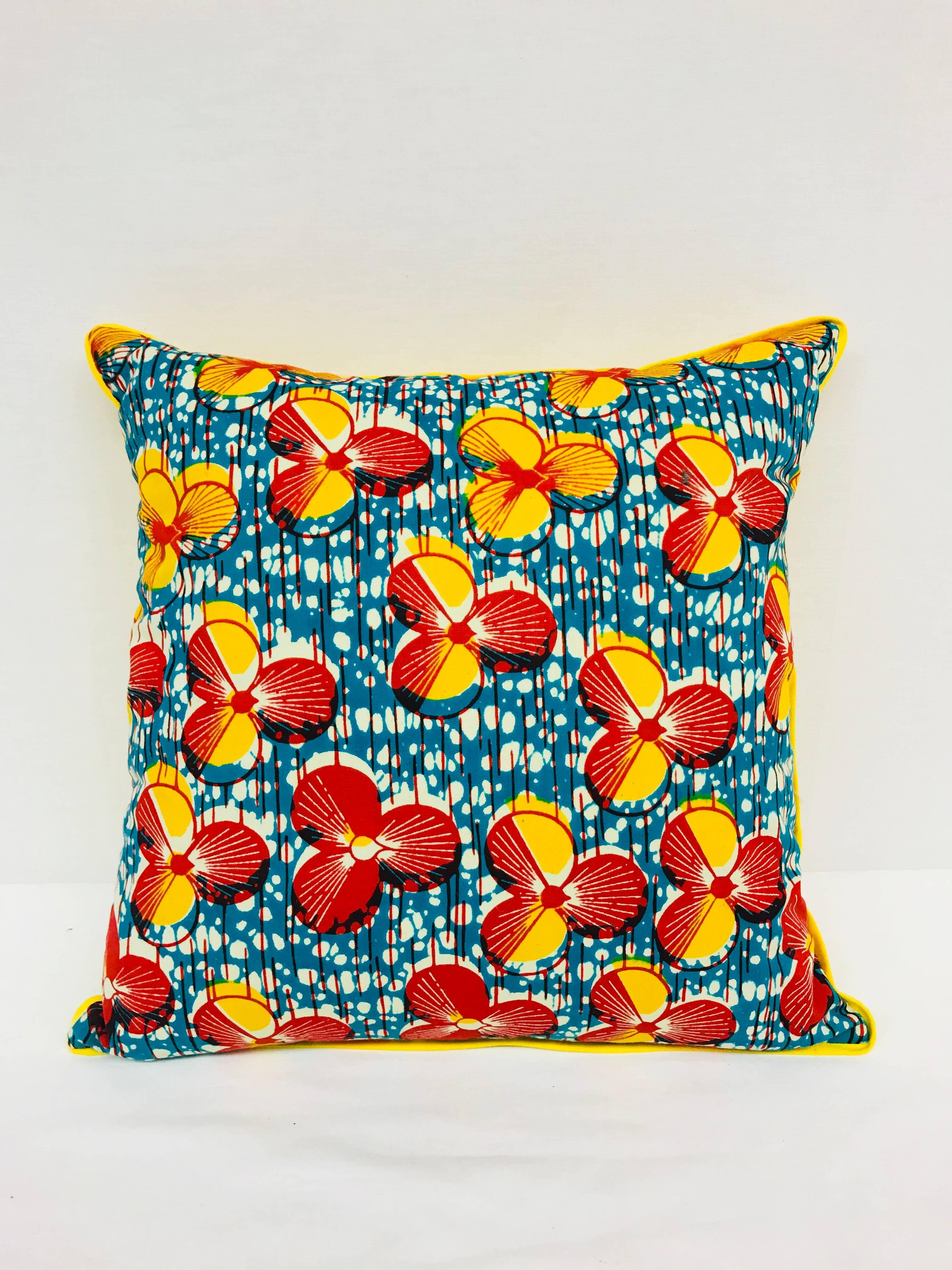 Crafted exclusively for Madcap Cottage in the USA, this African wax print pillow will bring a big dollop of delicious to a neutral sofa, bed or chair. Backed in a kicky yellow hue. Made from Vlisco authentic Dutch Wax fabrics. Down alternative