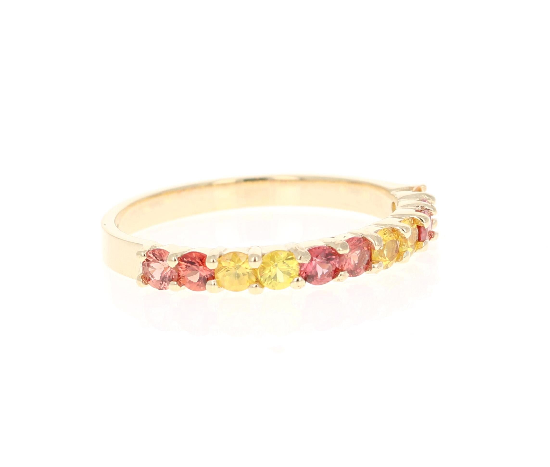 There are 11 Multicolored Genuine Red and Yellow Sapphires in this band that weigh 0.90 Carats.  
It is perfect for everyday wear and looks amazing stacked or alone. 
This band is created in 14 Karat Yellow Gold and weighs approximately 1.9