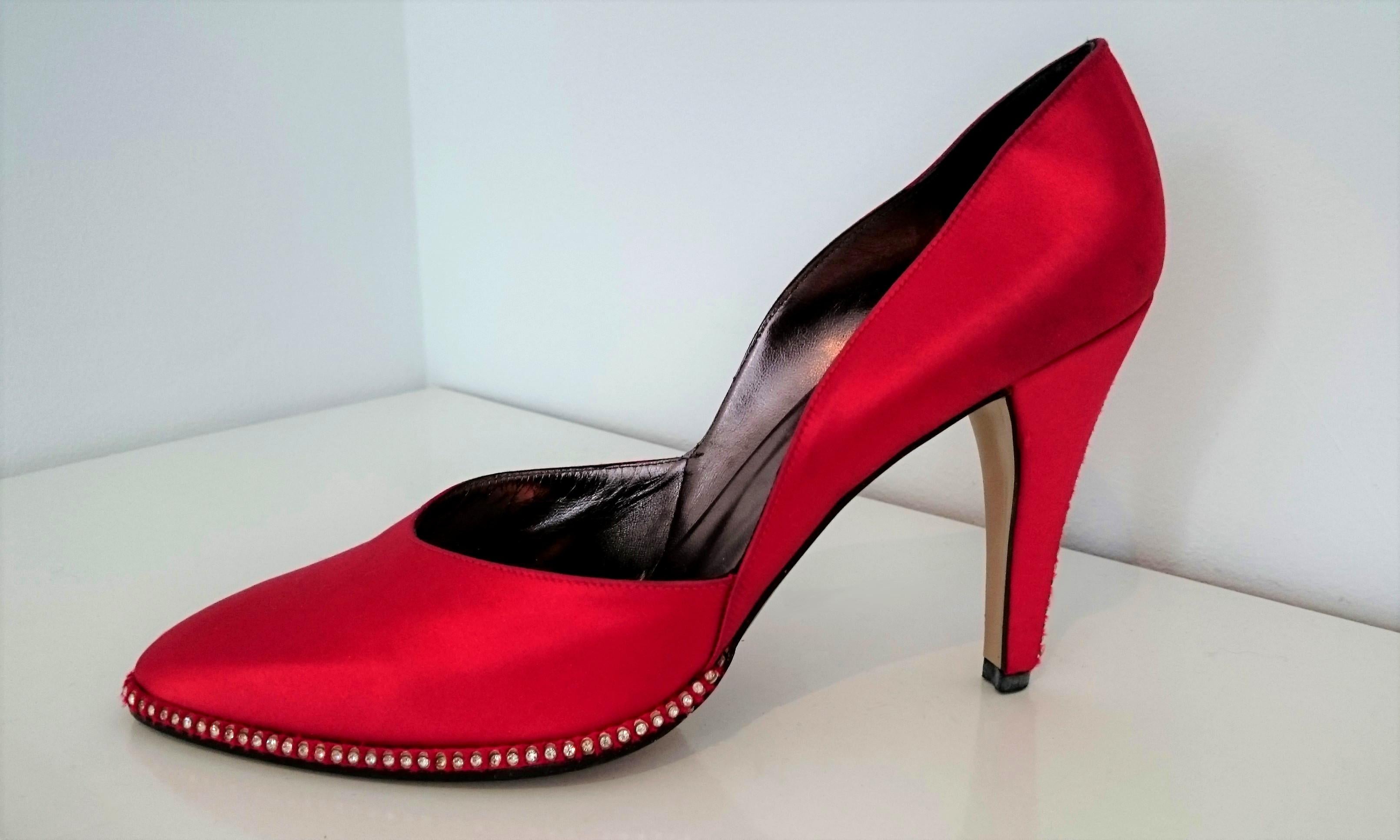 Red YSL Silk Heels Embroidered with Swarovski.
They are in very good condition, barely used for few days. 
The good condition can be seen by looking at the sole and heel.

Each shoe has 80 Swarovski diamonds around it and 25 on the back. 105