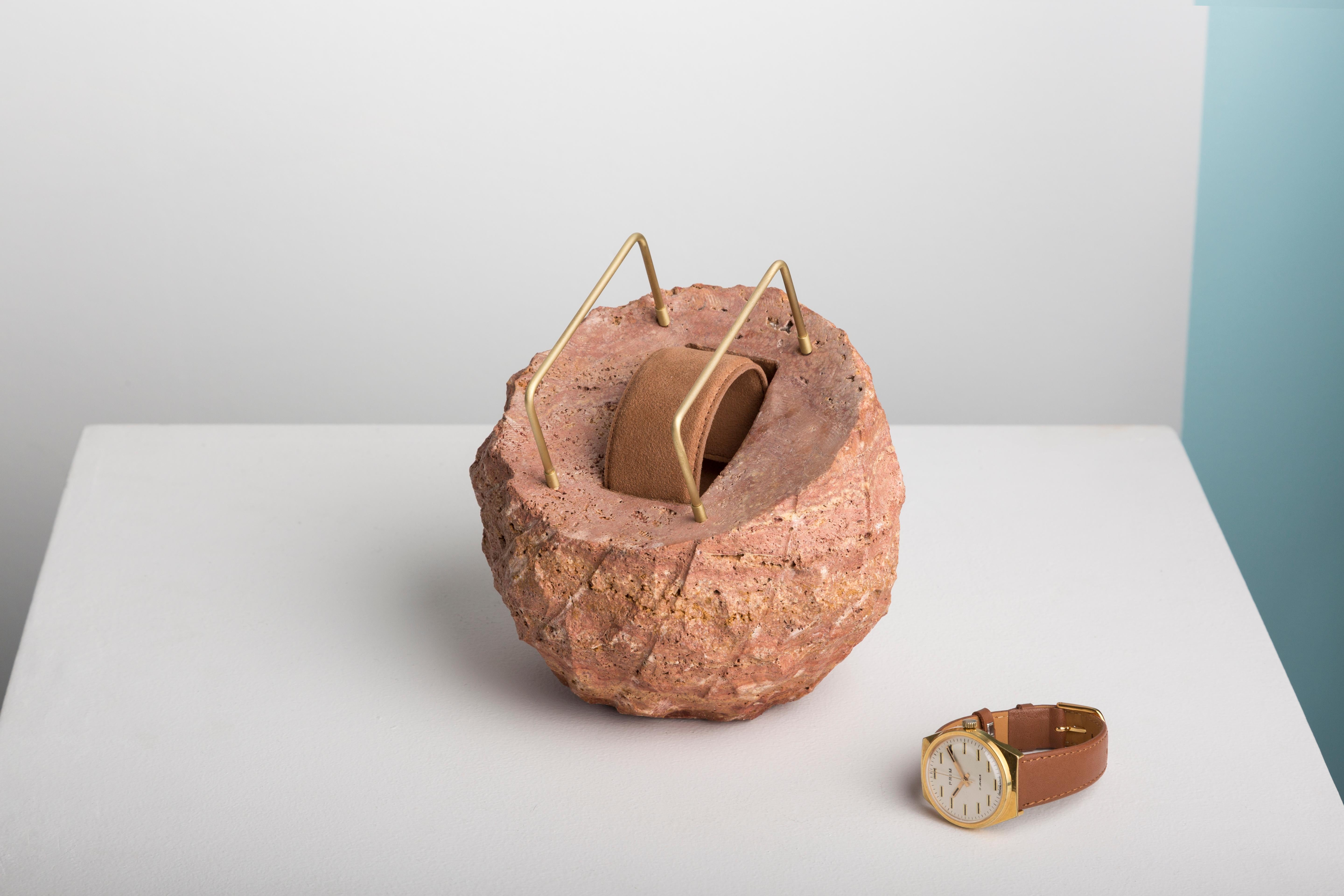 Red Zaman watch stand by T Sakhi Studio
Materials: Red travertino, brass, suede
Dimensions: W 20 cm, H 20 cm

The craftsmanship emphasizes various cultural heritages; leather and metal in Lebanon and stone and minerals in Egypt, where was the