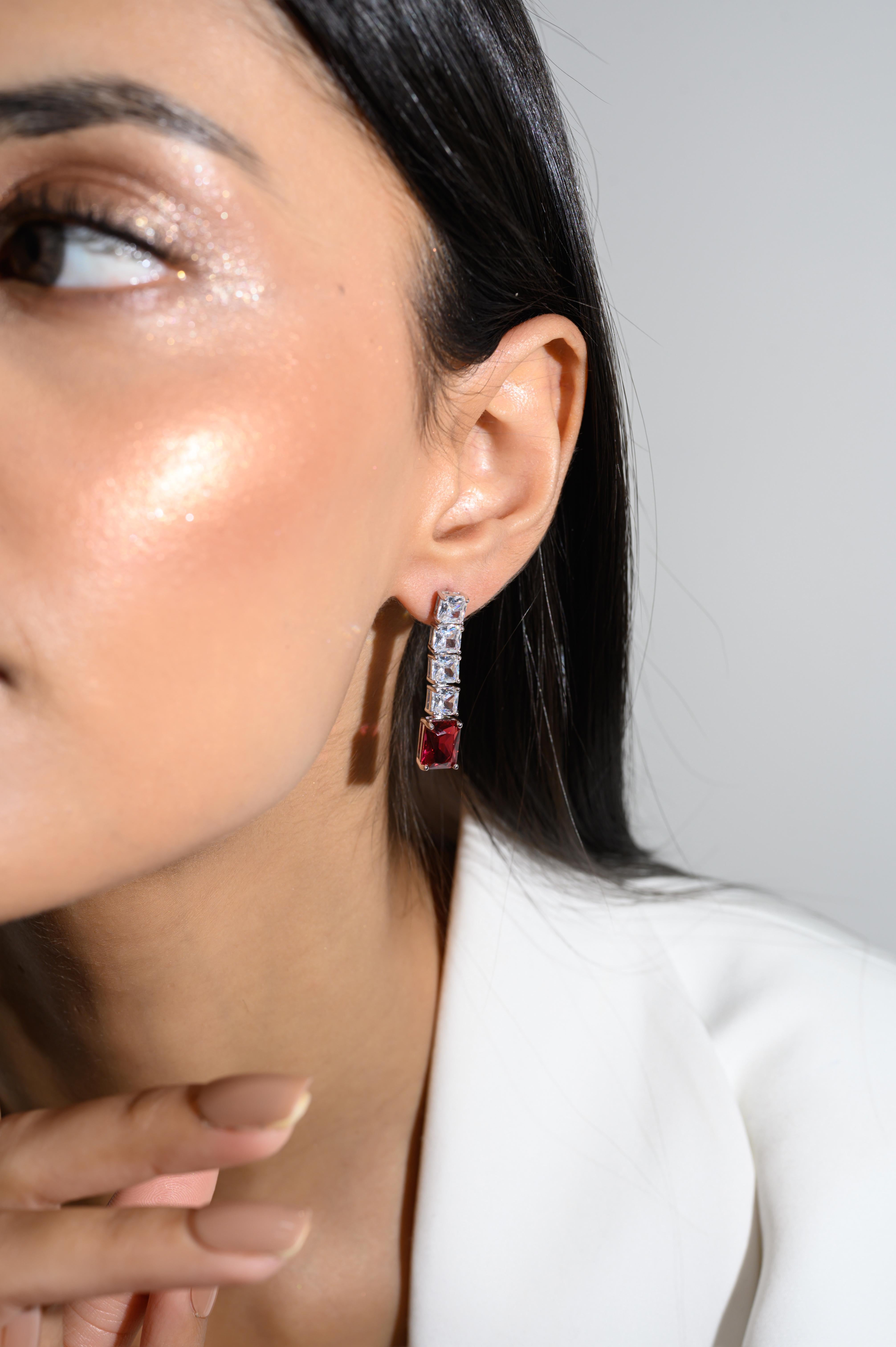 Red Zirconia Linear Drop Earrings in sterling silver. You shall need these statement drop earrings to make a statement with your look. Each piece features dazzling cubic zirconia stones, renowned for their brilliance and clarity, set in high-quality