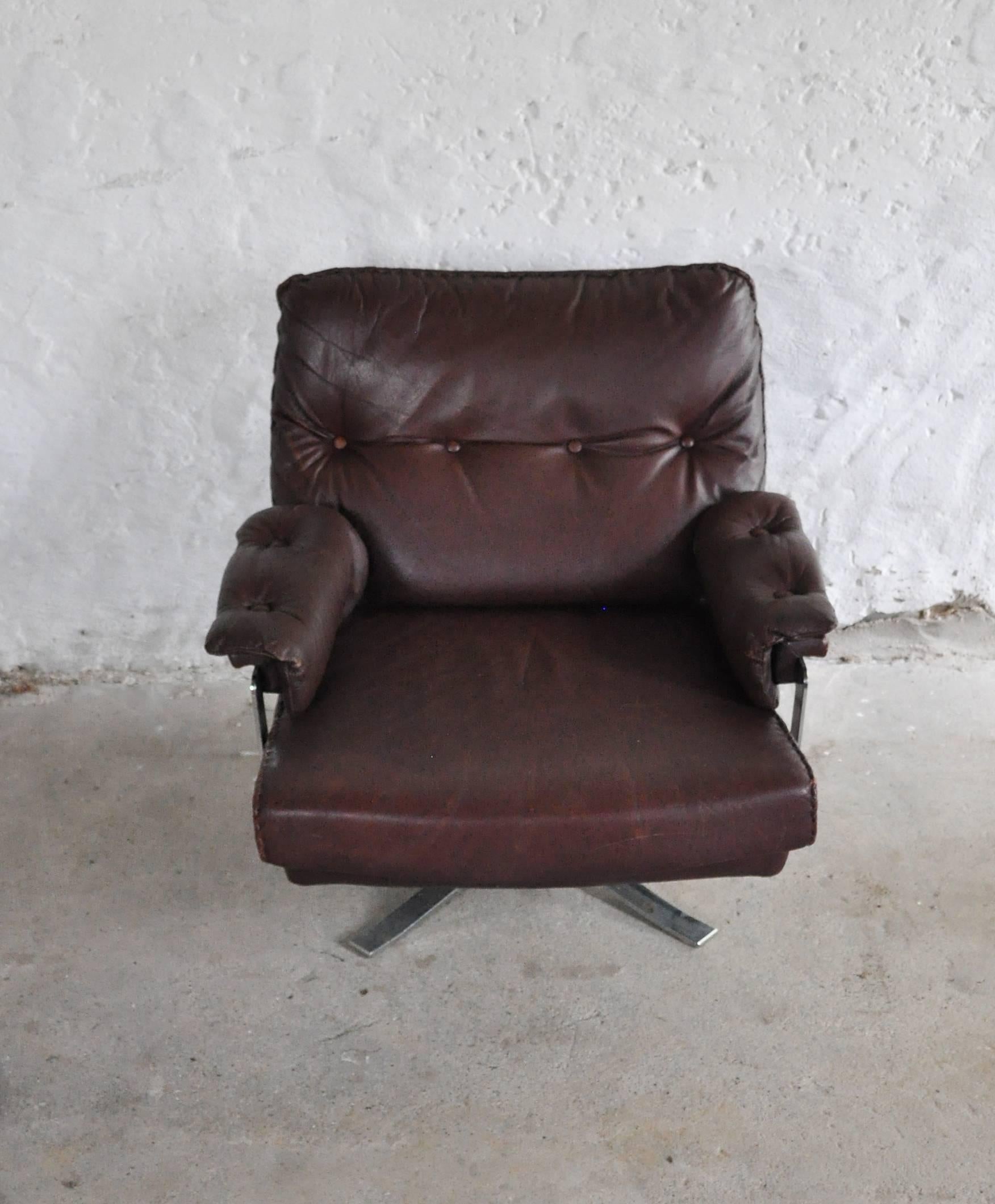 Scandinavian Modern Reddish Brown Leather and Chrome Lounge Chair and Stool by Arne Norell For Sale