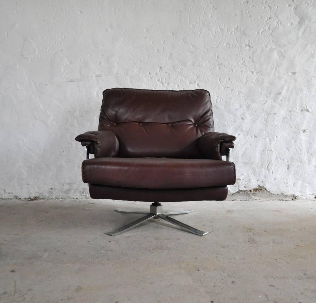 Norwegian Reddish Brown Leather and Chrome Lounge Chair and Stool by Arne Norell For Sale