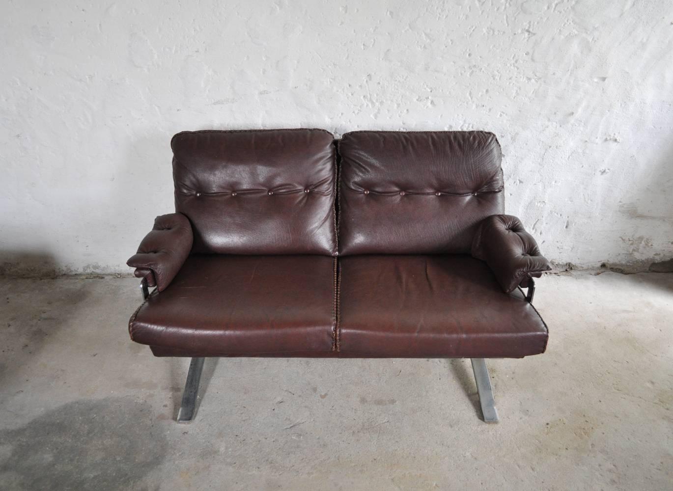 Reddish brown leather and chrome sofa by Arne Norell.
High quality hand-stitched leather.
Very fine vintage condition.
Lounge chair and three-seat sofa also available.