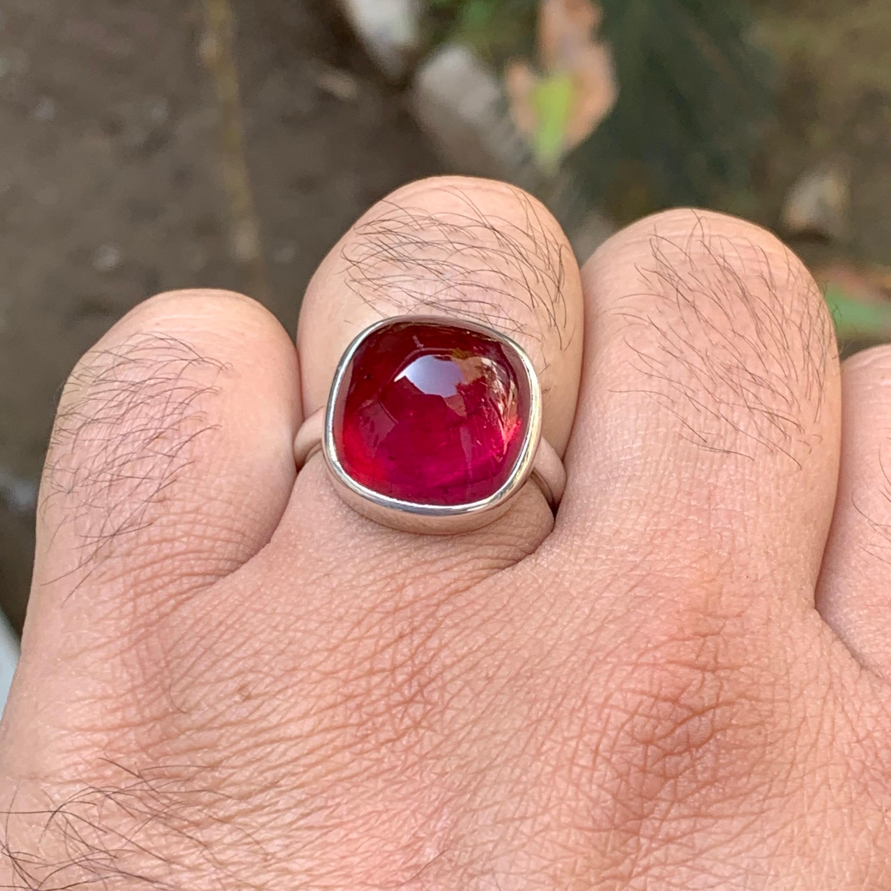 Rare Reddish Pink Natural Rubellite Tourmaline Sugarloaf Cabochon Gemstone Ring in a Pure 925 Sterling Silver!!

💎 GEMSTONE TYPE: Rubellite Tourmaline
⚖️ RING WEIGHT: 9.49 Grams
💎 STONE WEIGHT: 25 Plus Carat
💍  RING SIZE: 9.5 US
🌈 COLOR: Reddish