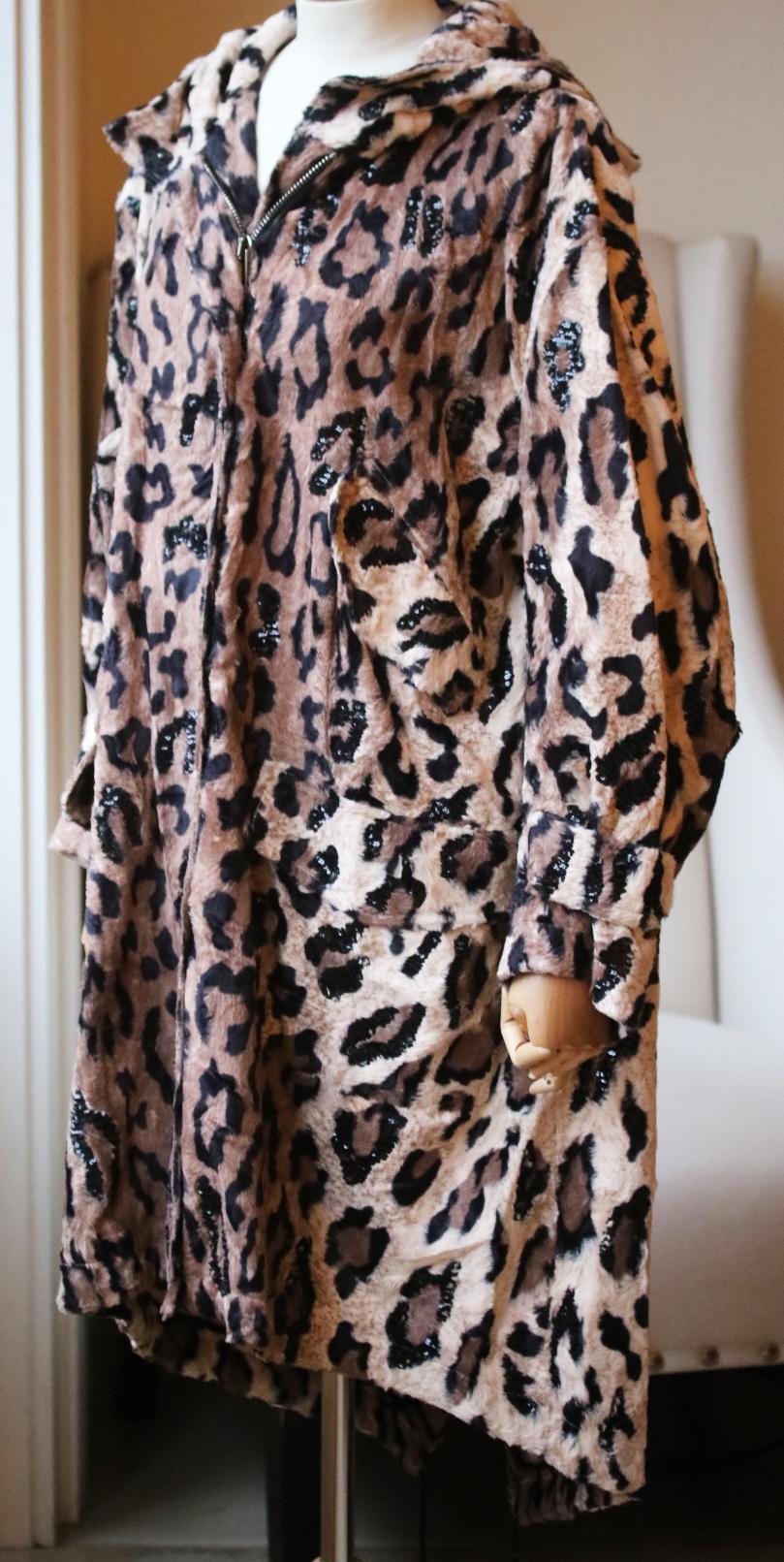 Beige and brown cotton blend parka. Leopard print parka coat from Redemption featuring a zip-up front fastening. Sequin embellishment detail all over. Two front pockets. An oversized fit. Made in Italy. 48% Cotton, 37% viscose, 15% modal. Lining: