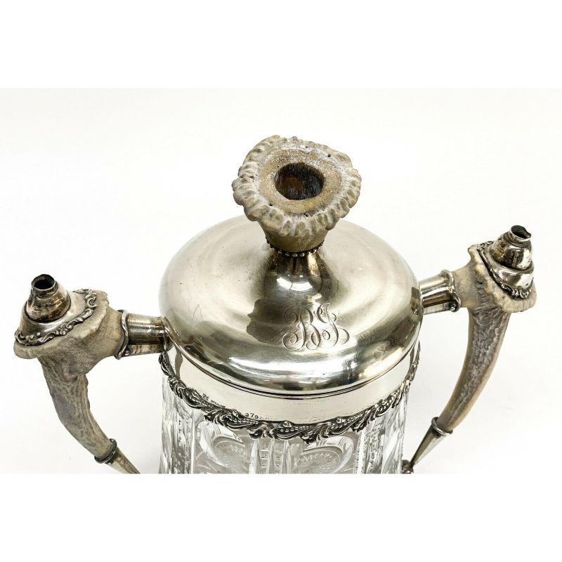 Redlich & Co. sterling silver & cut glass antler twin handled jar cigar humidor

circa 1900. Antler to the twin handles and finial of the silver lid. Cut vertical designs to the body of the glass. Redlich & Co. hallmark to the lid.

Additional