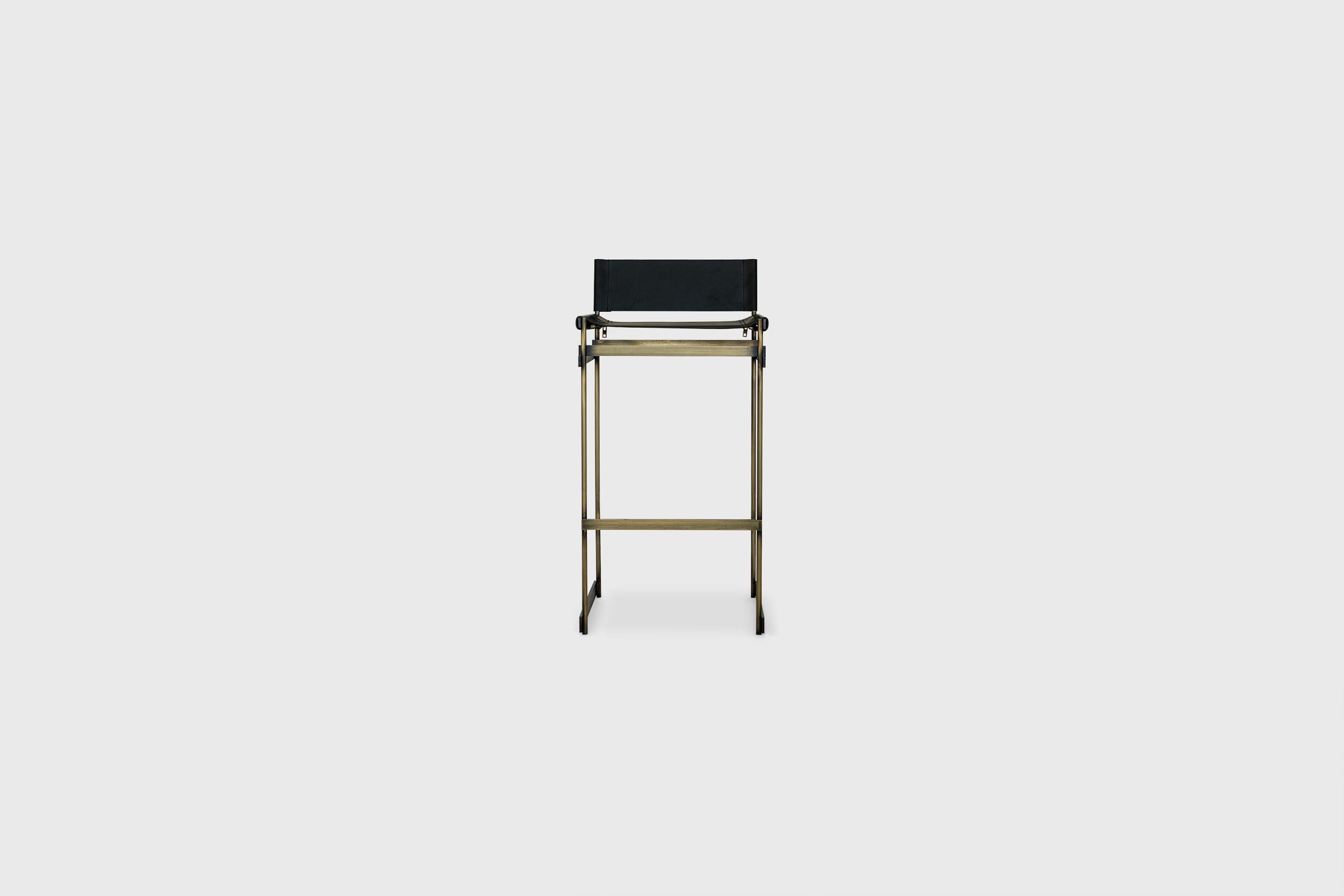 The Redo bar stool in National Leather Seat, Aged Brass Finished Steel Frame
and Brass Zips

Designer: Alexander Diaz Anderson 

Dimensions 
L 44.3cm/17.4”
W 46.2cm/18.1”
H 90.9cm/35.7”

All our items are customizable to your size, requirements and
