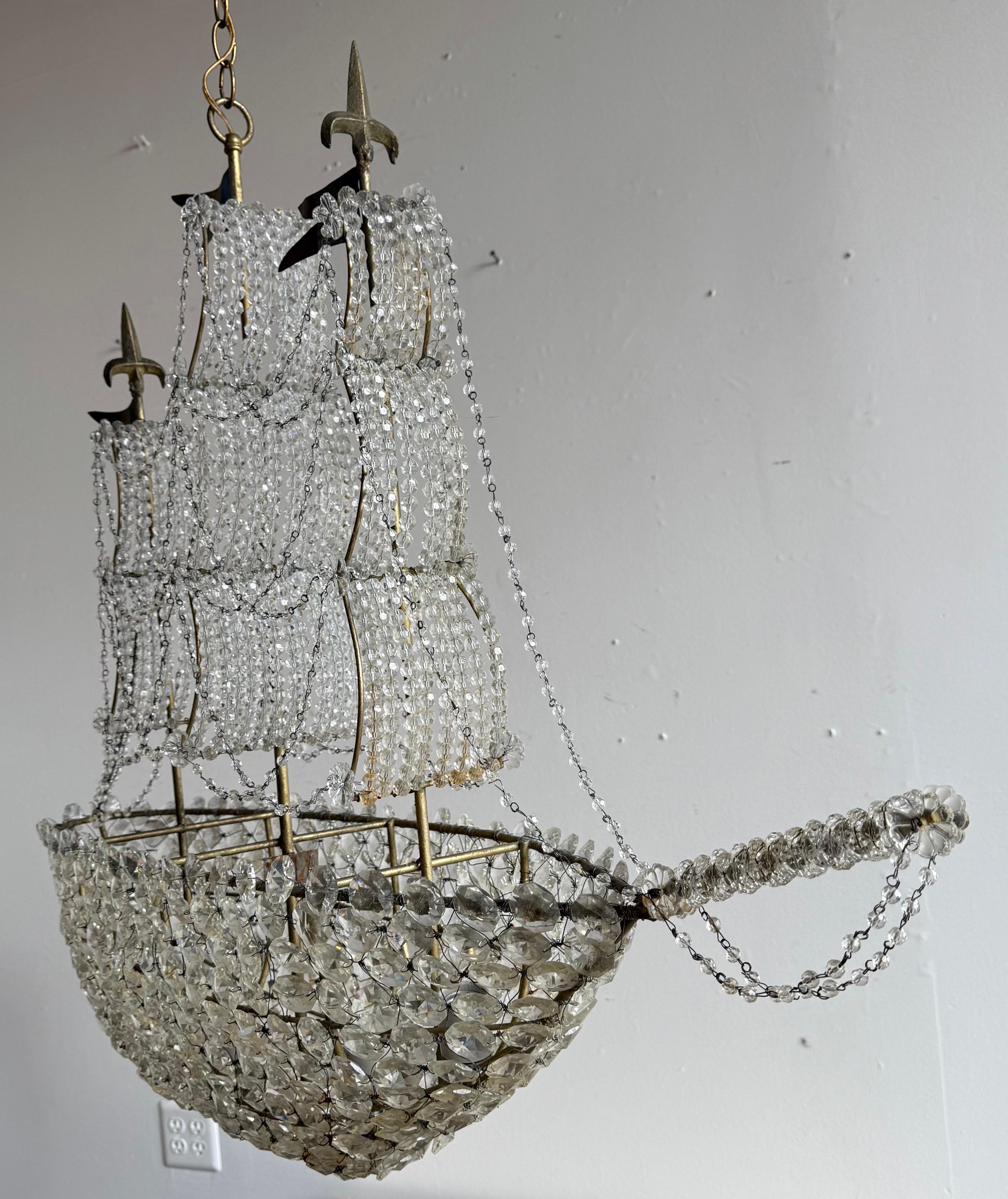 Custom Crystal Hand-Beaded Ship Chandelier by Miamar Home – Los Angeles

A striking and whimsical statement piece, this custom ship-shaped chandelier is an original creation by Miamar Home, a Los Angeles-based atelier renowned for its finely