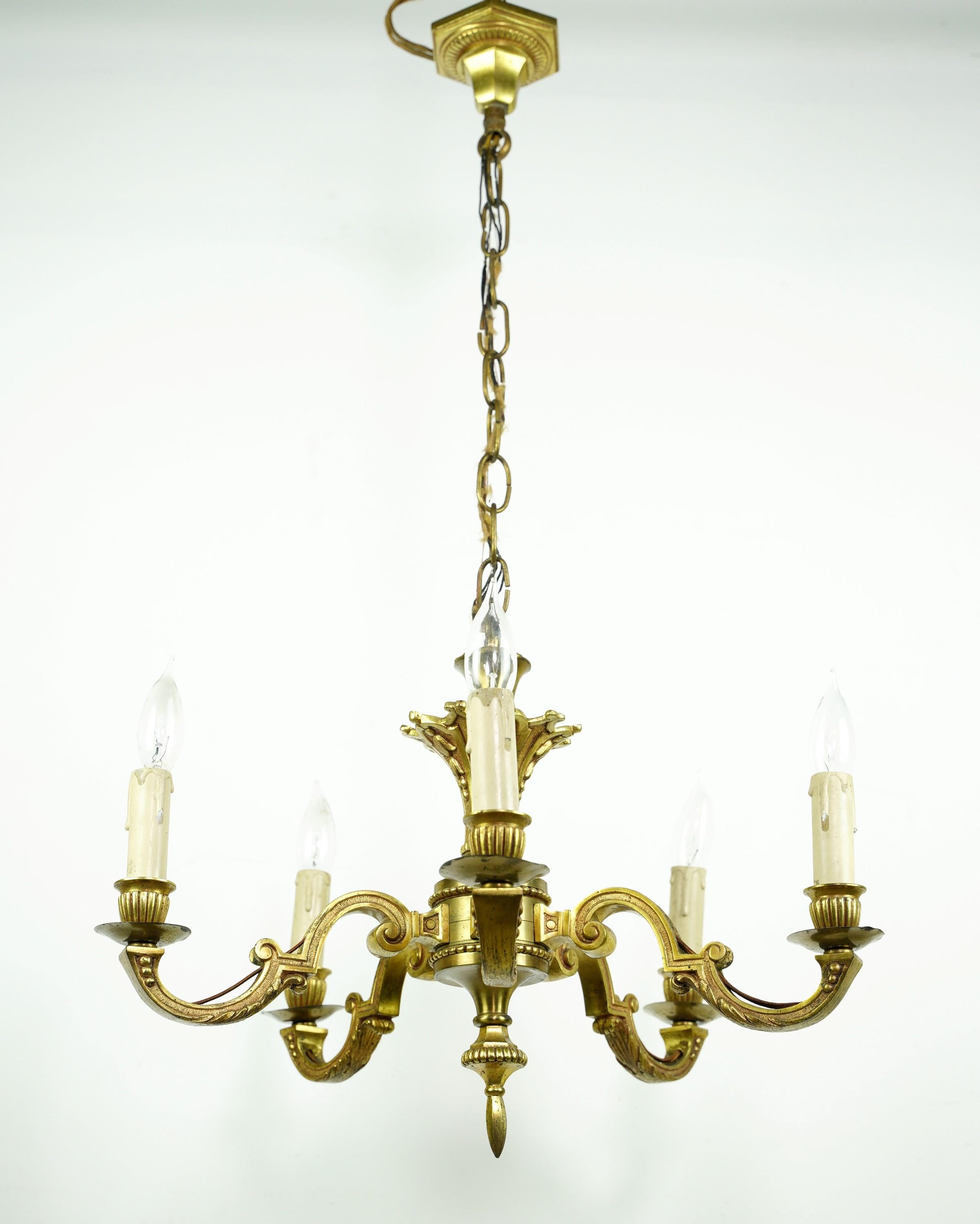 Polished brass five arm chandelier with ornate Art Deco designs. Cleaned and restored. Please note, this item is located in our Scranton, PA location.