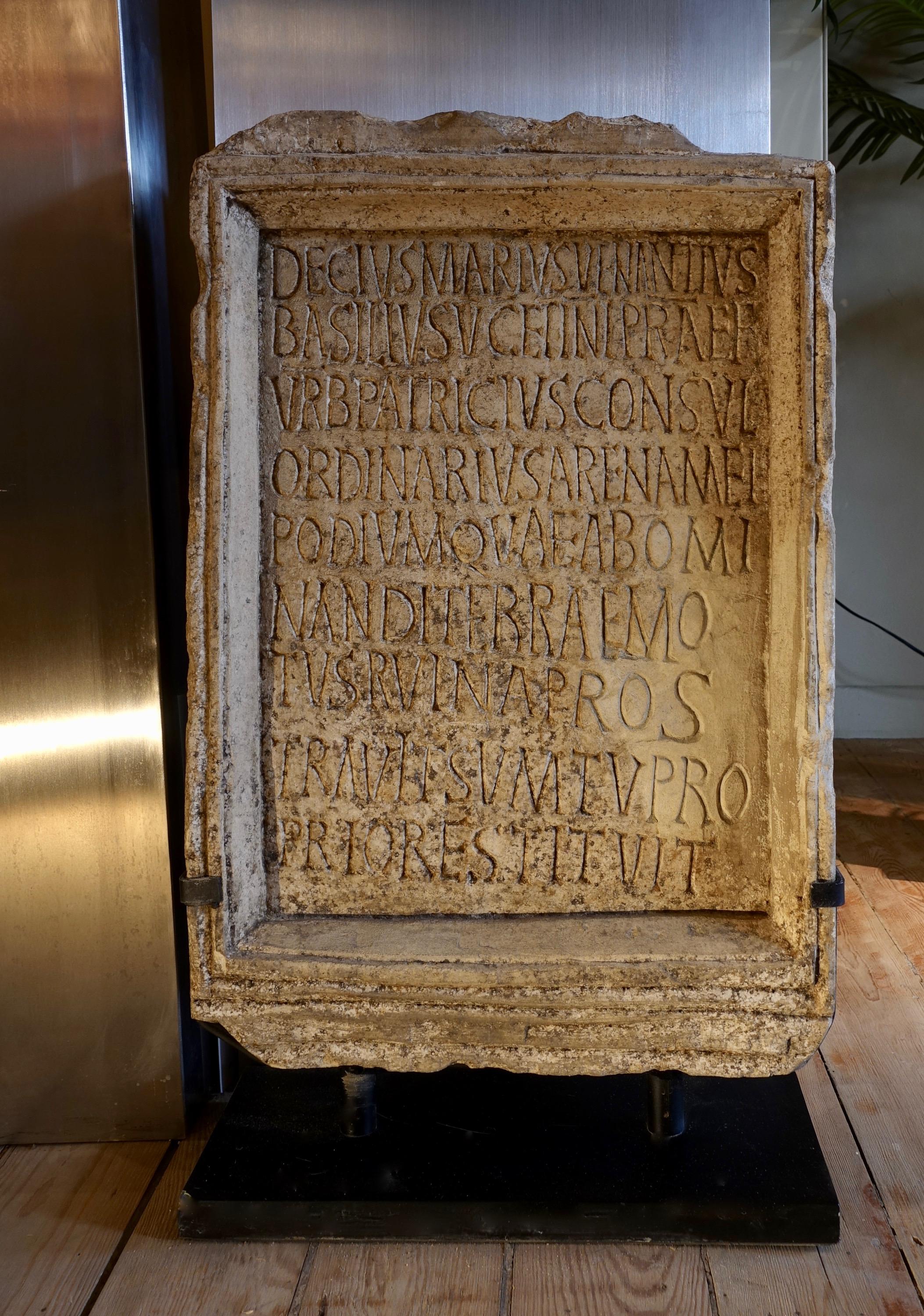 Reduced-size inscription as on the famous Roman epitaph of the Coliseum 
19th century, Grand Tour 
Stone; modern metal pedestal 
68 x 40 x 10,5 cm (with the pedestal)

DECIUS MARIUS VENANTIUS BASILIUS[,] V[IR] C[LARISSIMUS] ET INL[USTRIS][,]
