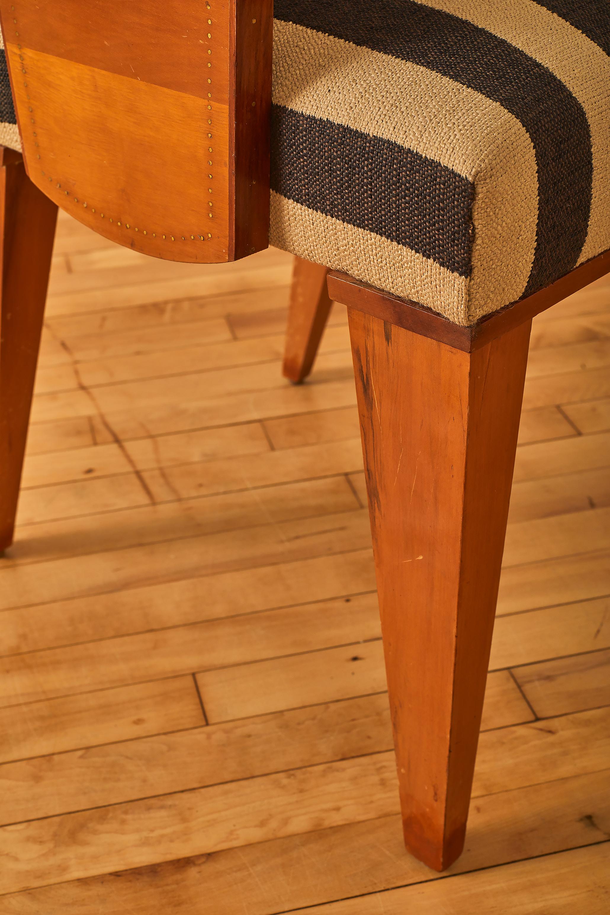 Armchair by Andre Sornay newly reupholstered in striped cotton fabric with a redwood structure. Impressed mark 