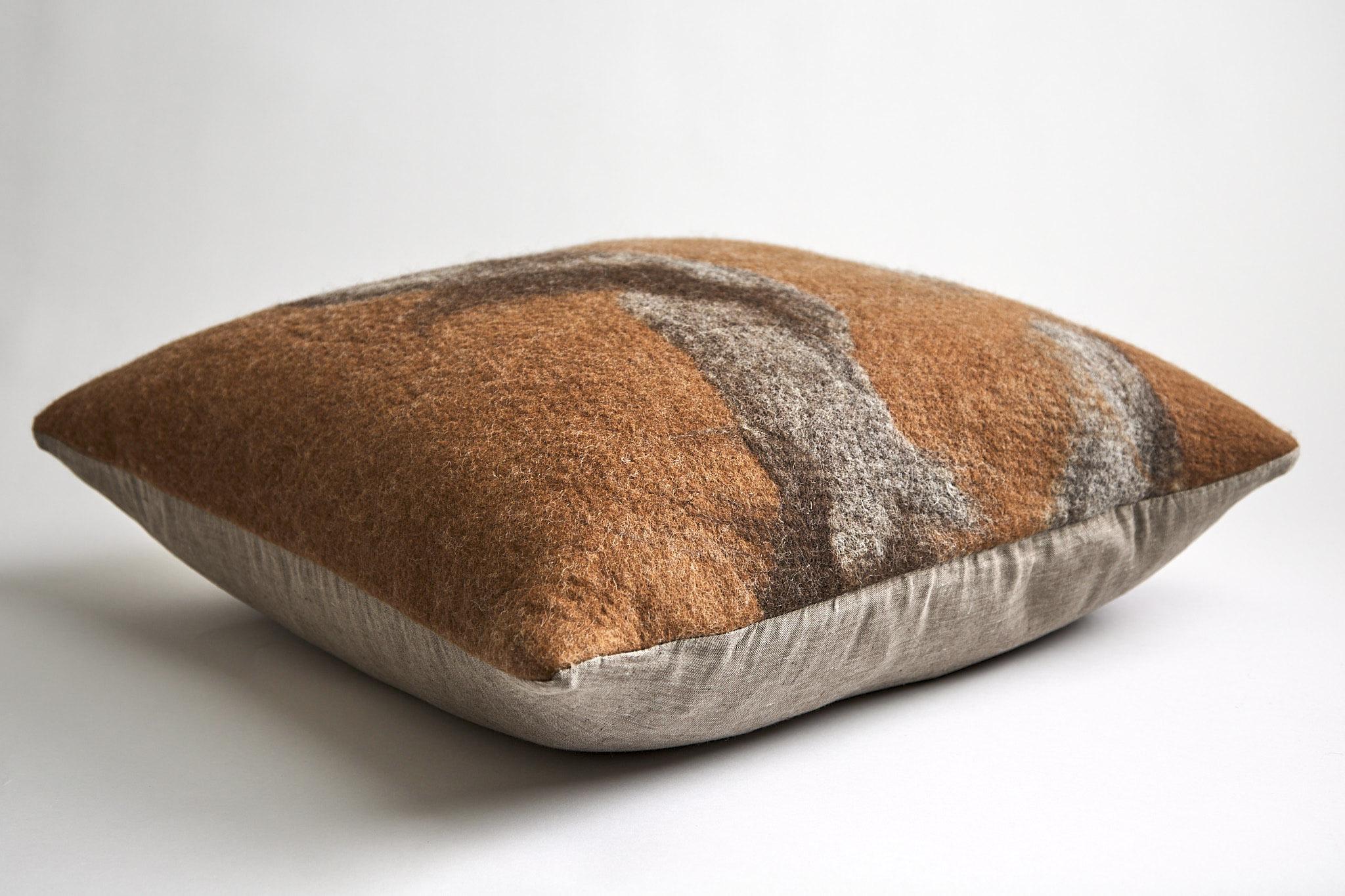 A gorgeous statement pillow hand painted in felted rust-colored Perendale glazed with Shetland gray wool. Milled in Sonoma, California, each is one-of-a-kind, no two are alike. With wool as the canvas, these artful pillows inspired by the