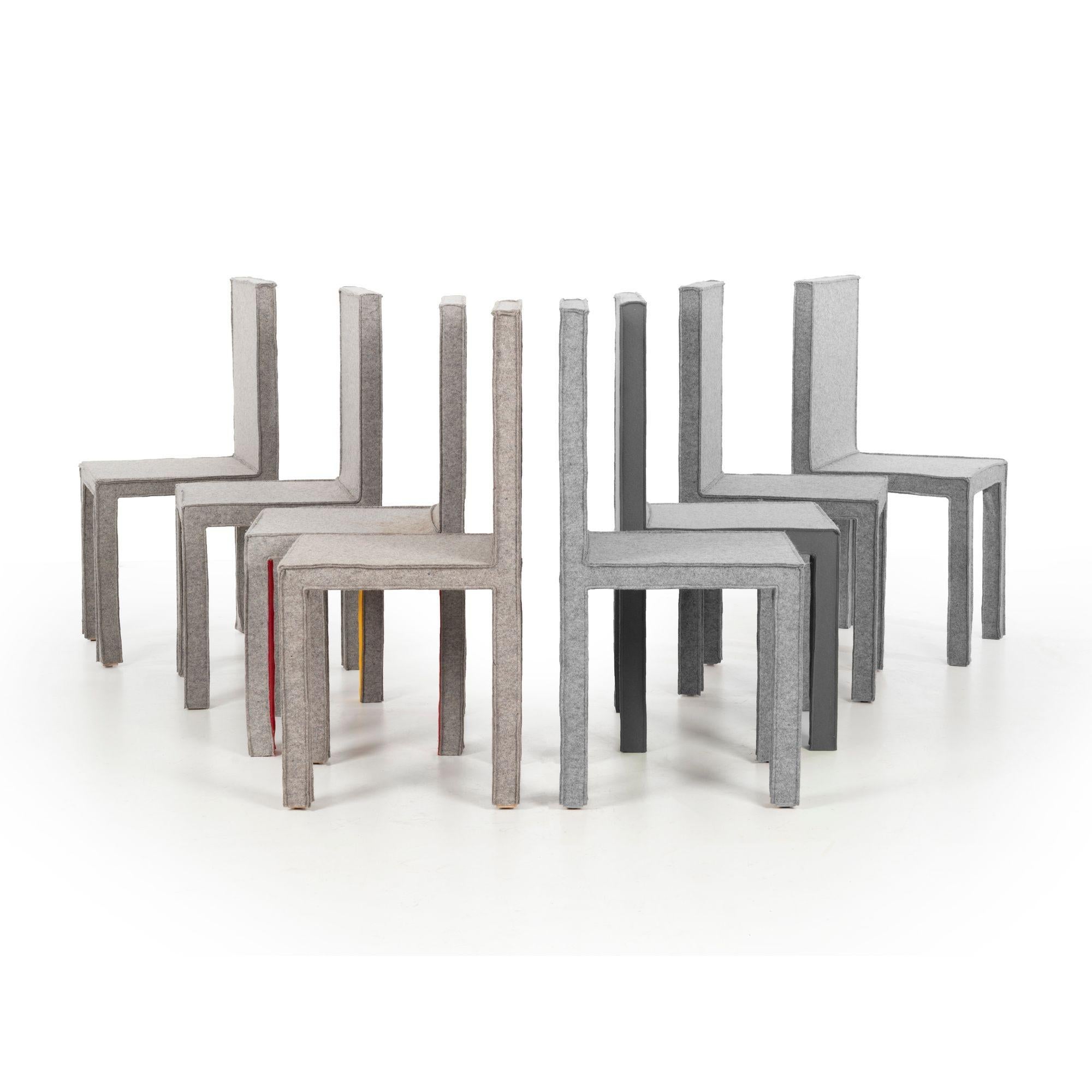 Reed and Delphine Krakoff RKDK dining chairs, set of eight for Established & Sons/ London 2014
Wool felt upholstery over beech wood with some chairs showing colored highlights.
Impressed decal underside.
 
 
 
Measure: seat height: 18