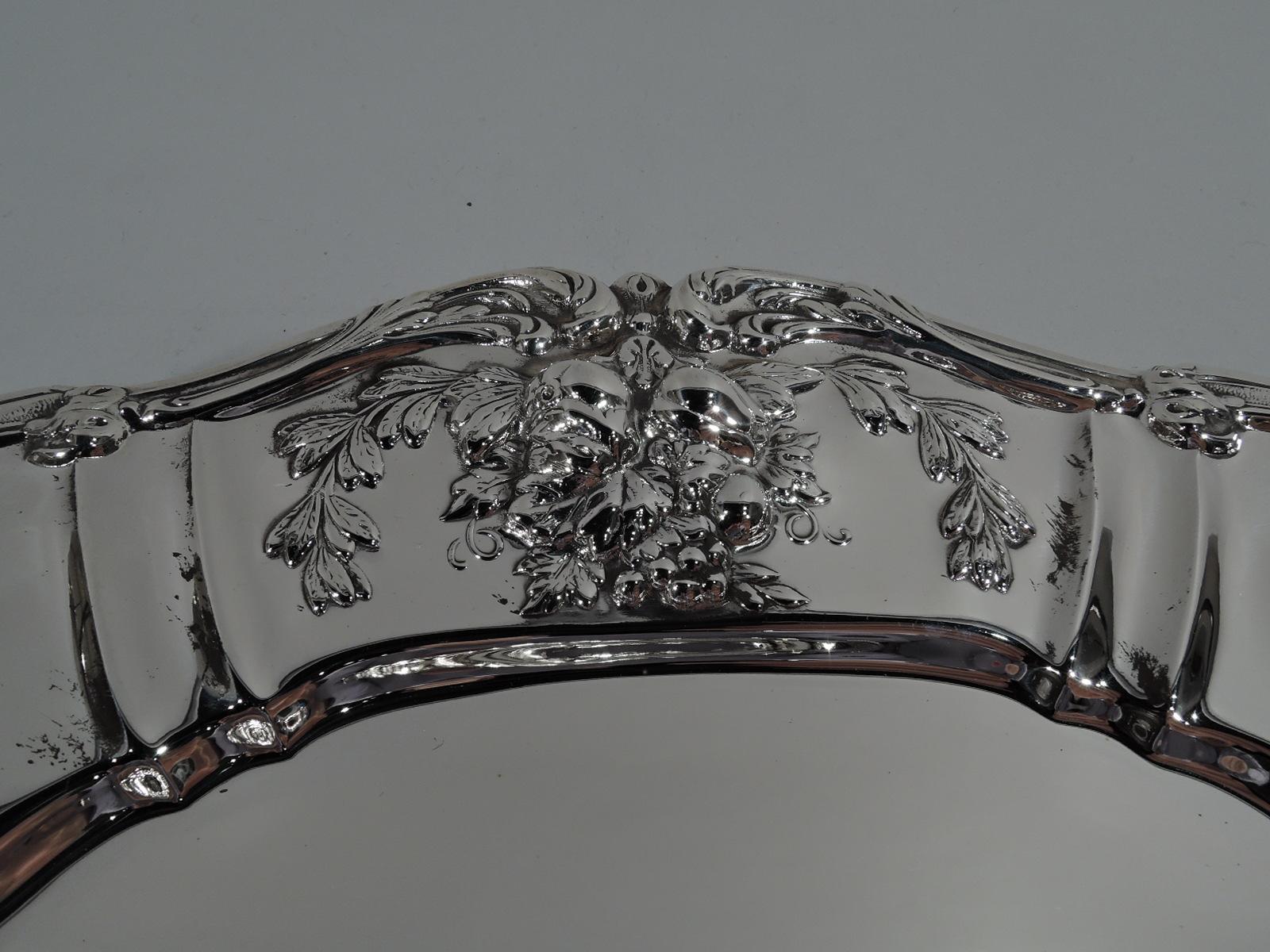 Francis I sterling silver serving plate. Made by Reed & Barton in Taunton, Mass. Shoulder has alternating wide and narrow frames with embossed vegetation, and scrolled rim. A beautiful piece in the desirable French Renaissance Revival pattern. Fully