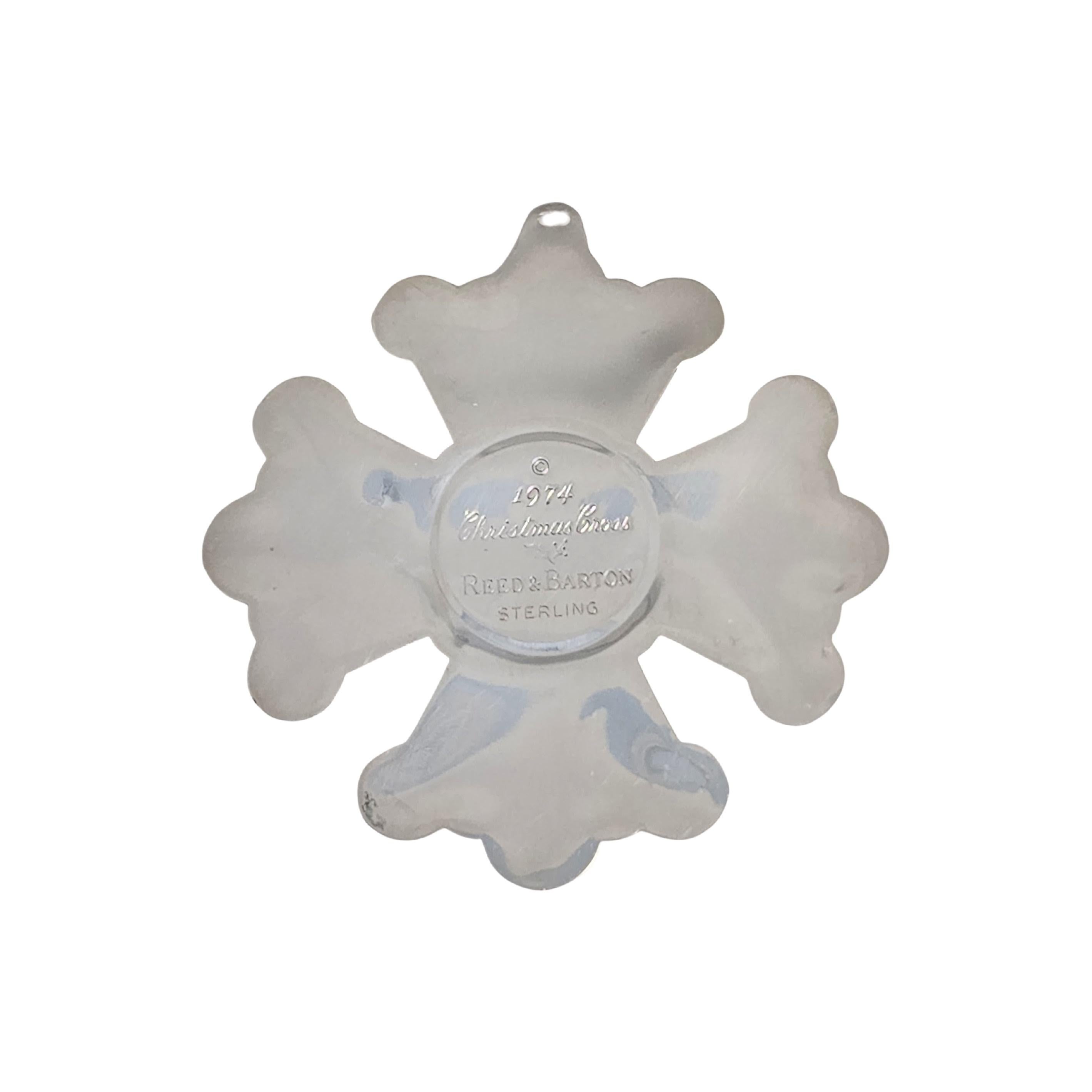 Sterling silver Christmas Cross ornament by Reed & Barton from 1974.

A beautifully detailed cross ornament featuring flower and swirl accents.

Weighs approx 9.7dwt, 15.1g

Measures approx 3 1/8