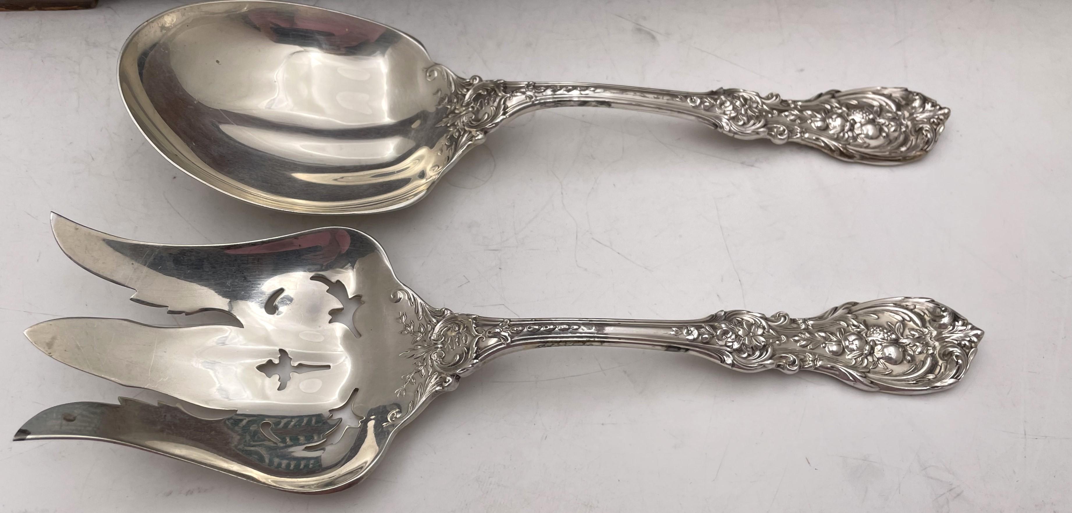 Reed & Barton sterling silver 90-piece flatware set in the celebrated Francis I pattern with exquisite fruit and floral motifs in Art Nouveau style consisting of:

- 12 French dinner knives measuring 9'' in length 

- 12 hollow-handled butter