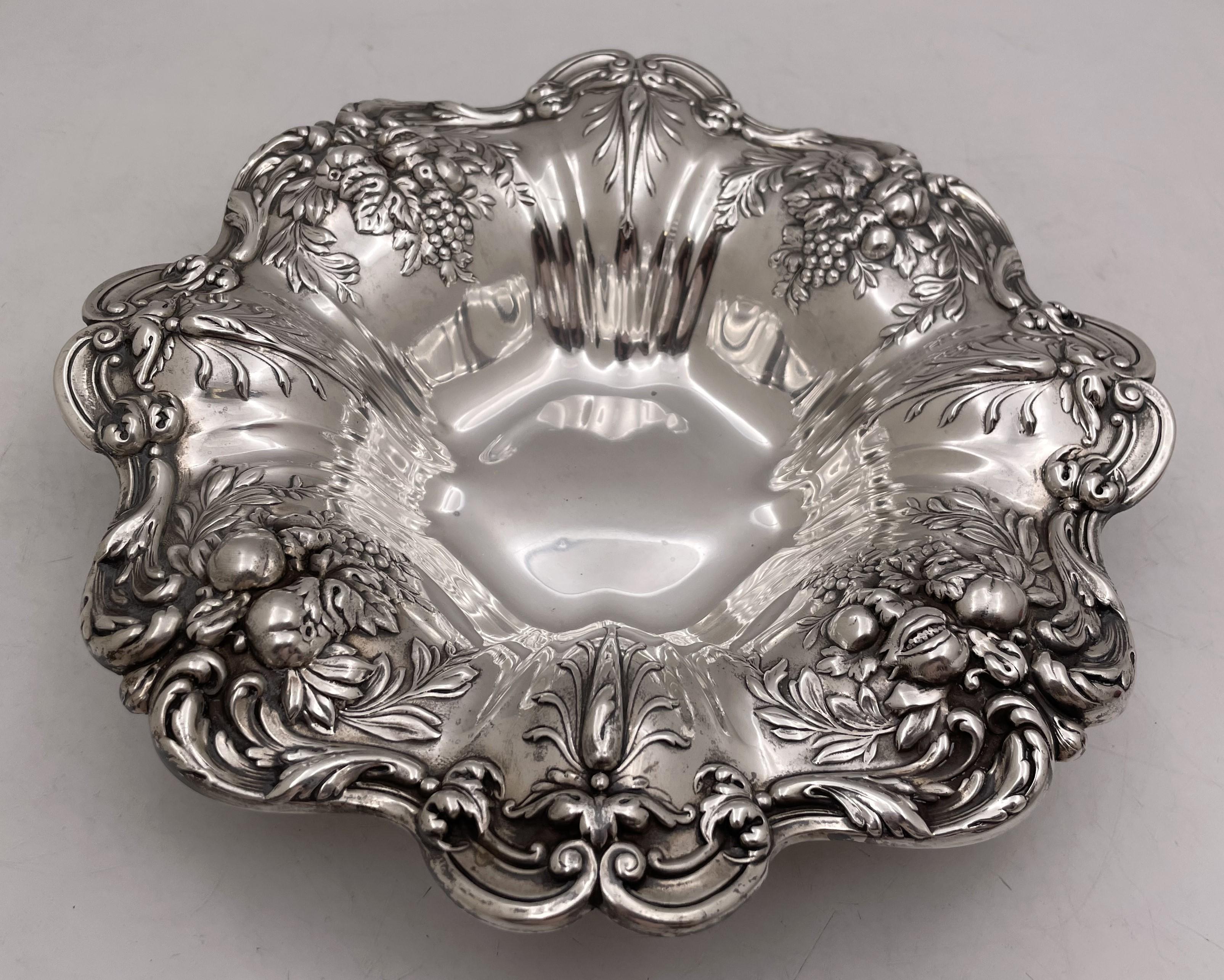 Reed & Barton sterling silver bowl in Francis I pattern number X569 and in Art Nouveau style, richly adorned with fruits and flowers. It measures 11 1/3'' in diameter by 2 2/3'' in height, weighs 20.8 troy ounces, and bears hallmarks as shown.