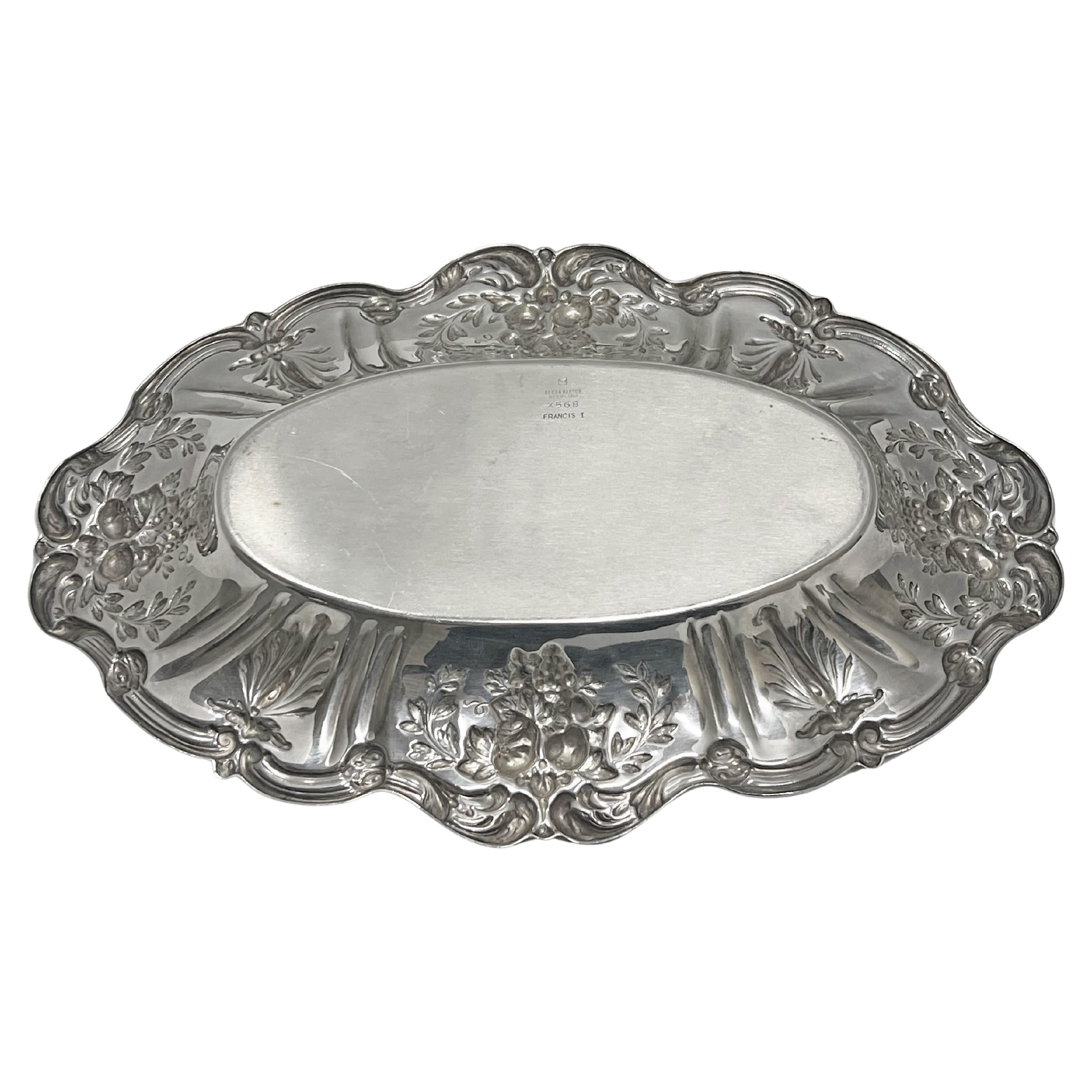 Beautiful sterling silver bread tray in the Francis I pattern by Reed & Barton.  Oval design decorated with fruit, leaves, acanthus leaves, and vine motifs on the raised border.  Polished oval center.  Underside of tray marked 'REED & BARTON