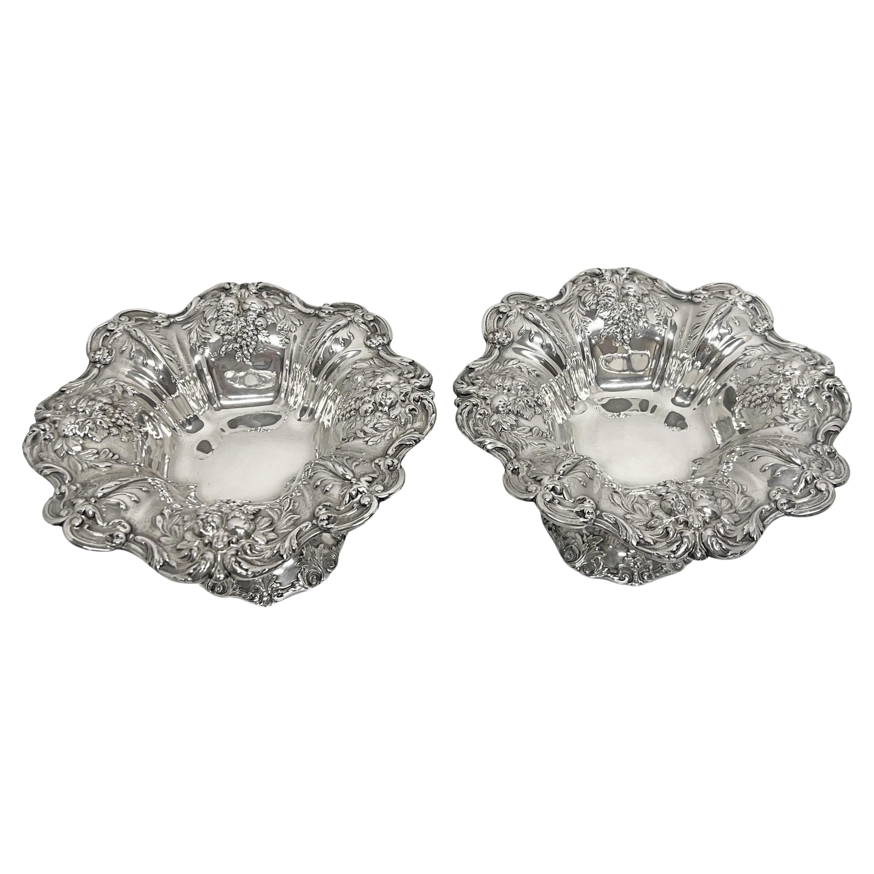 Reed & Barton pair of Francis I compotes in sterling silver.  Pattern X568.  Decorated border with acanthus leaf, fruit, flowers, and leaves.  Signed 'REED & BARTON Sterling X568 FRANCIS I' on the underside.  Measuring 8