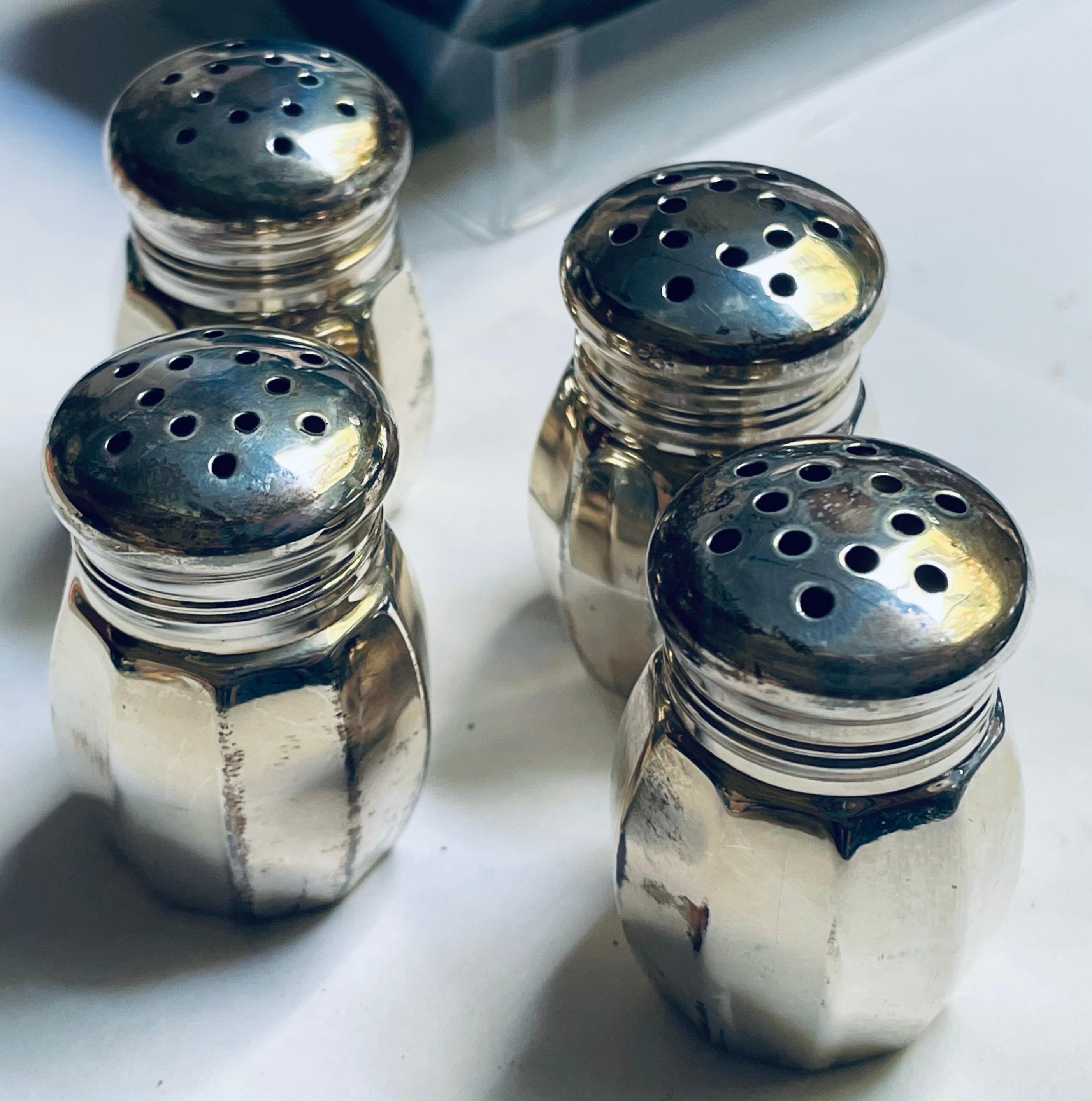 This is a sweet and elegant set of 4 individual sterling silver salt & pepper shakers in their original packaging including the outer sleeve. They were made by Reed & Barton and each still have there plastic interior liner to prevent corrosion