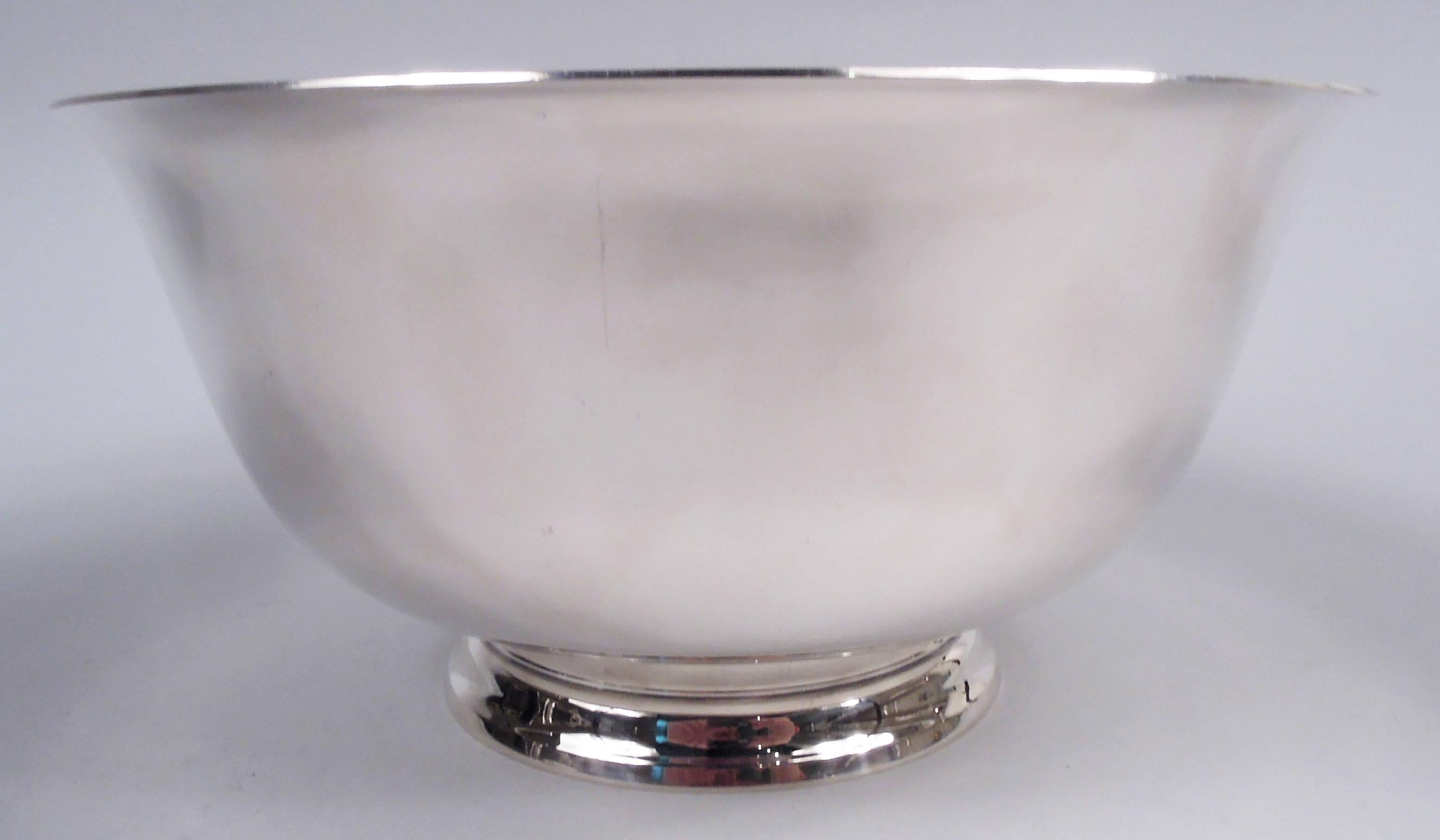 American Colonial sterling silver bowl. Made by Reed & Barton in Taunton in 1950. Curved and tapering sides, flared rim, and stepped foot. Traditional form with plenty of room for engraving. Fully marked including maker’s stamp, date symbol, and no.