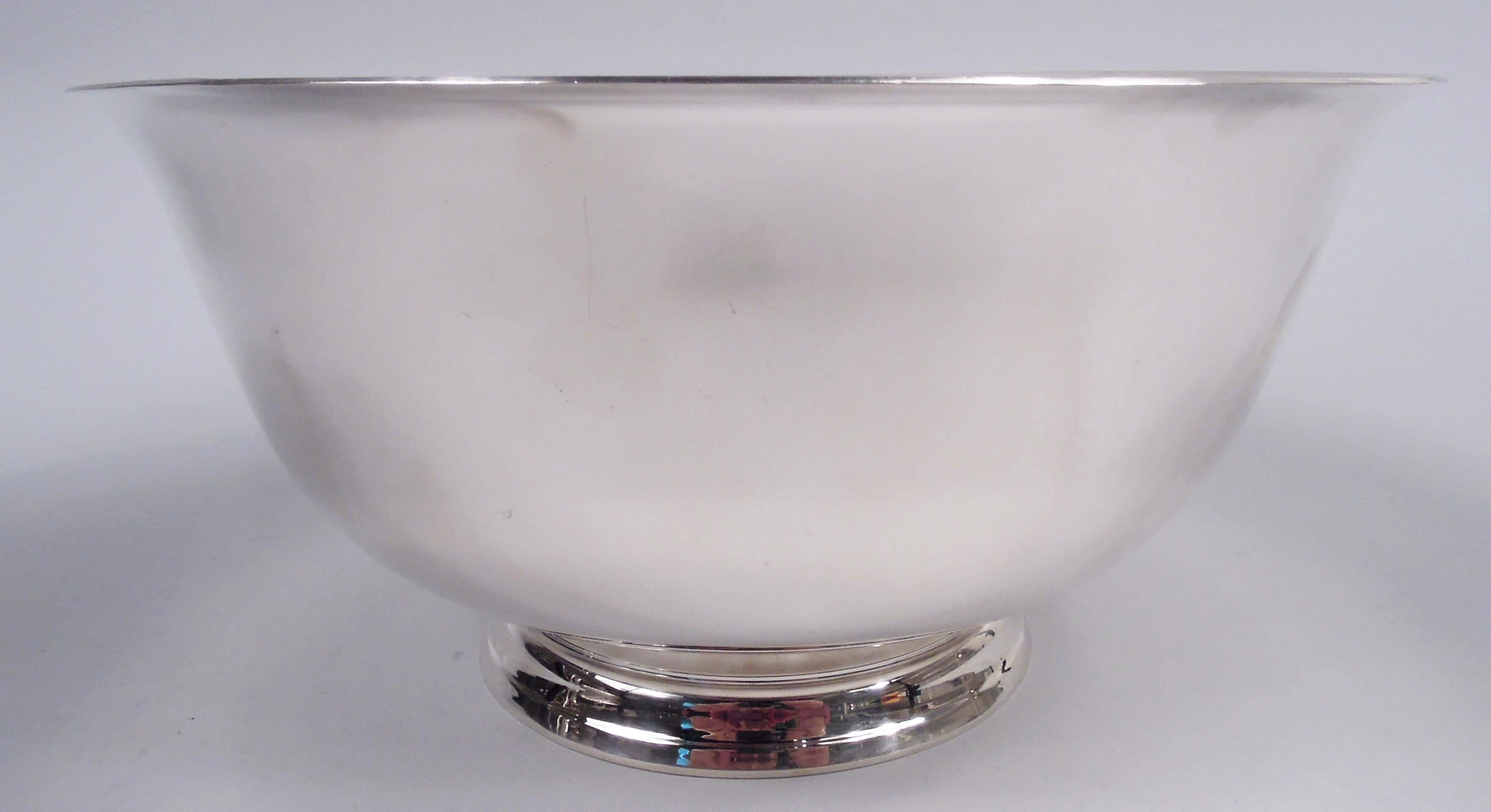 American Colonial sterling silver bowl. Made by Reed & Barton in Taunton in 1956. Curved and tapering sides, flared rim, and stepped foot. Traditional from with plenty of room for engraving. Fully marked including maker’s stamp, date symbol, and no.