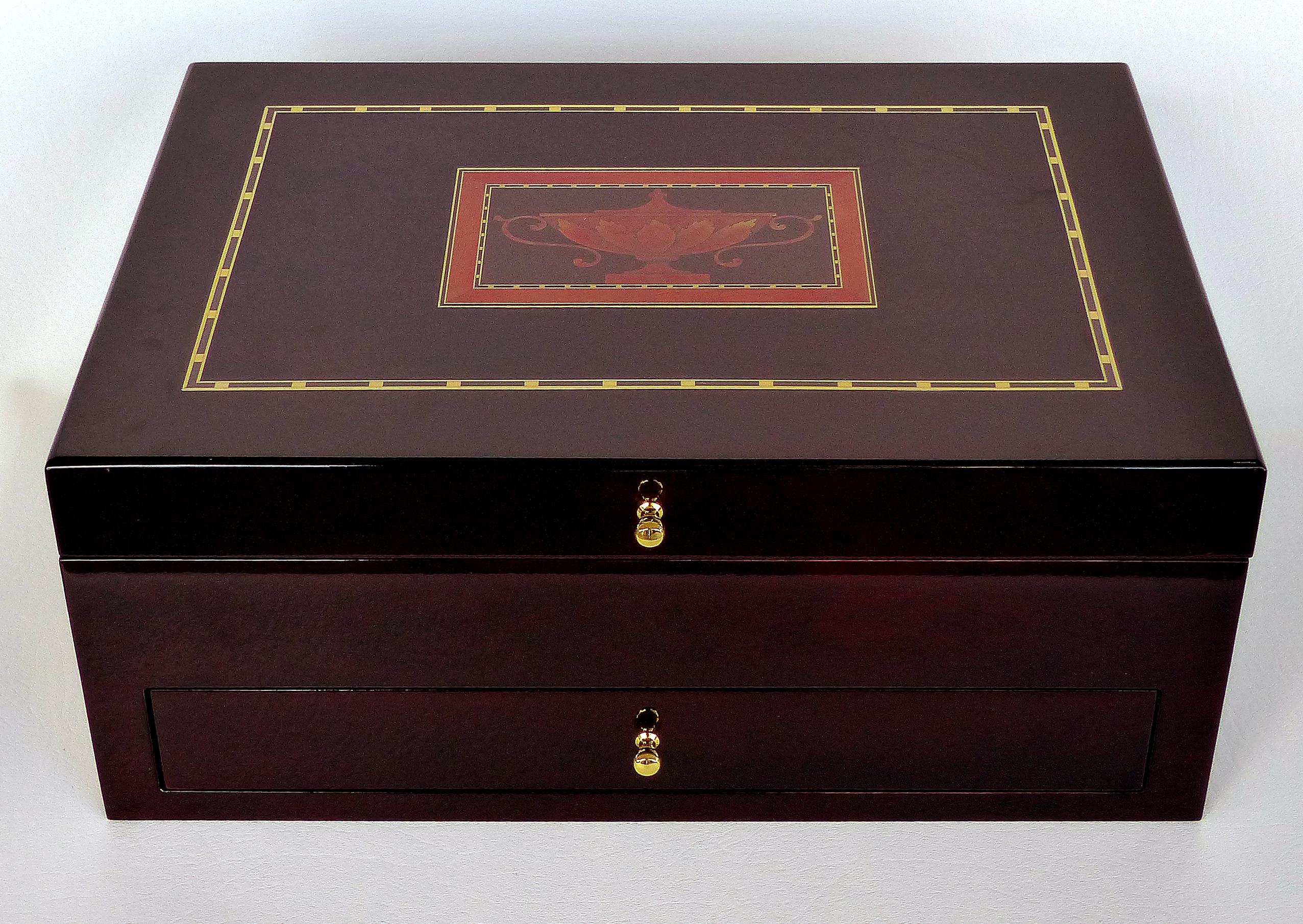 Offered for sale is a Reed & Barton lined silver chest with marquetry details in the American 18th century style.