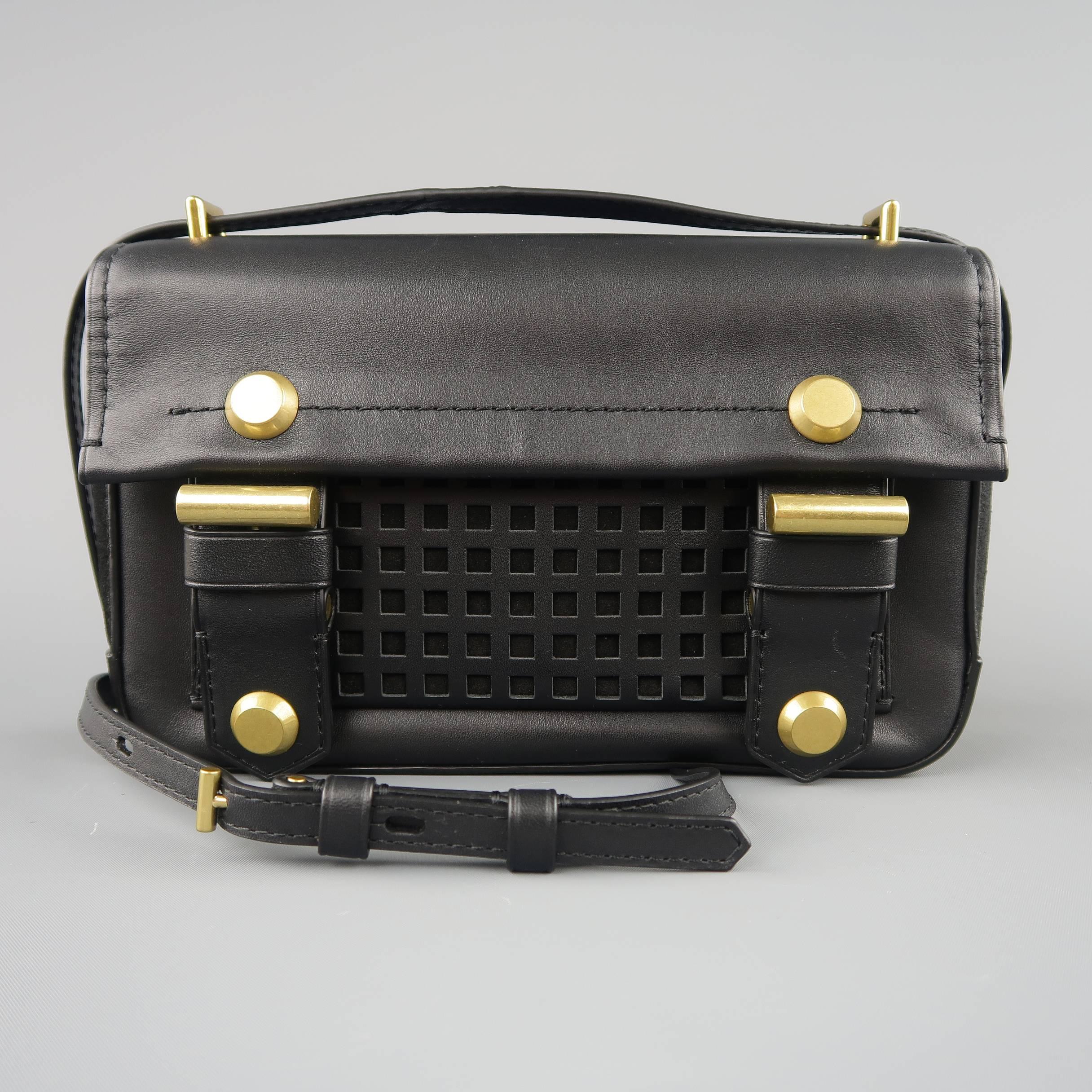 REED KRAKOFF satchel bag comes in smooth black leather with suede sides, flap closure with double snap tabs, gold tone brass stud hardware, and grid perforated pockets.
 
Brand New.
 
Measurements:
 
Length: 9.5 in.
Width: 2 in.
Height: 6 in.
Drop: