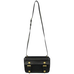 Borsetta Reed Krakoff in pelle nera con hardware in ottone e oro