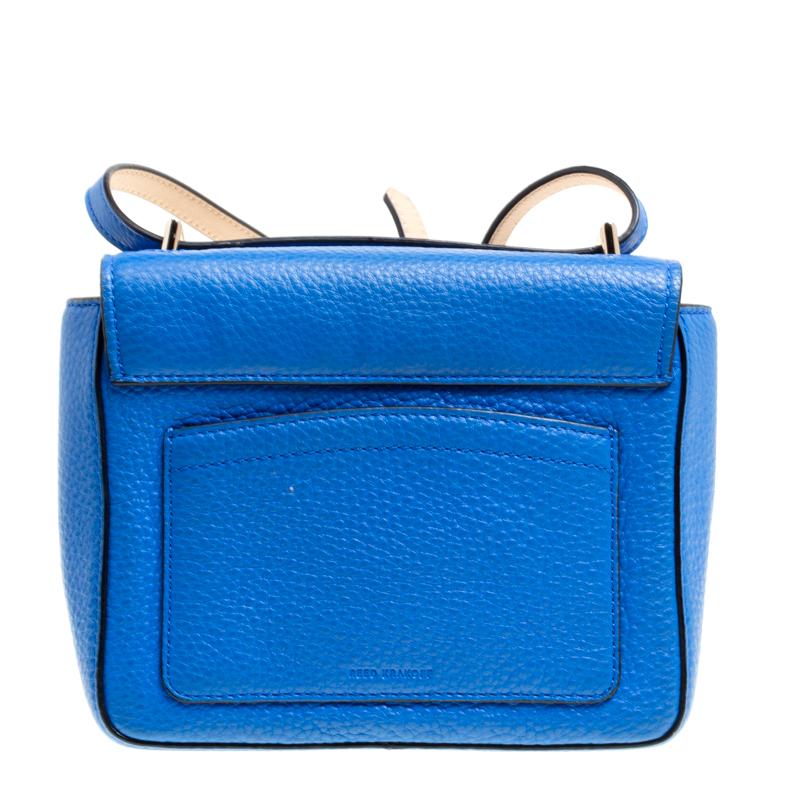 A perfect bag to take for shopping or otherwise, this shoulder bag from Reed Krakoff is crafted from blue leather. It features a front flap secured with an interesting snap closure, a long leather shoulder strap that can be adjusted and a spacious