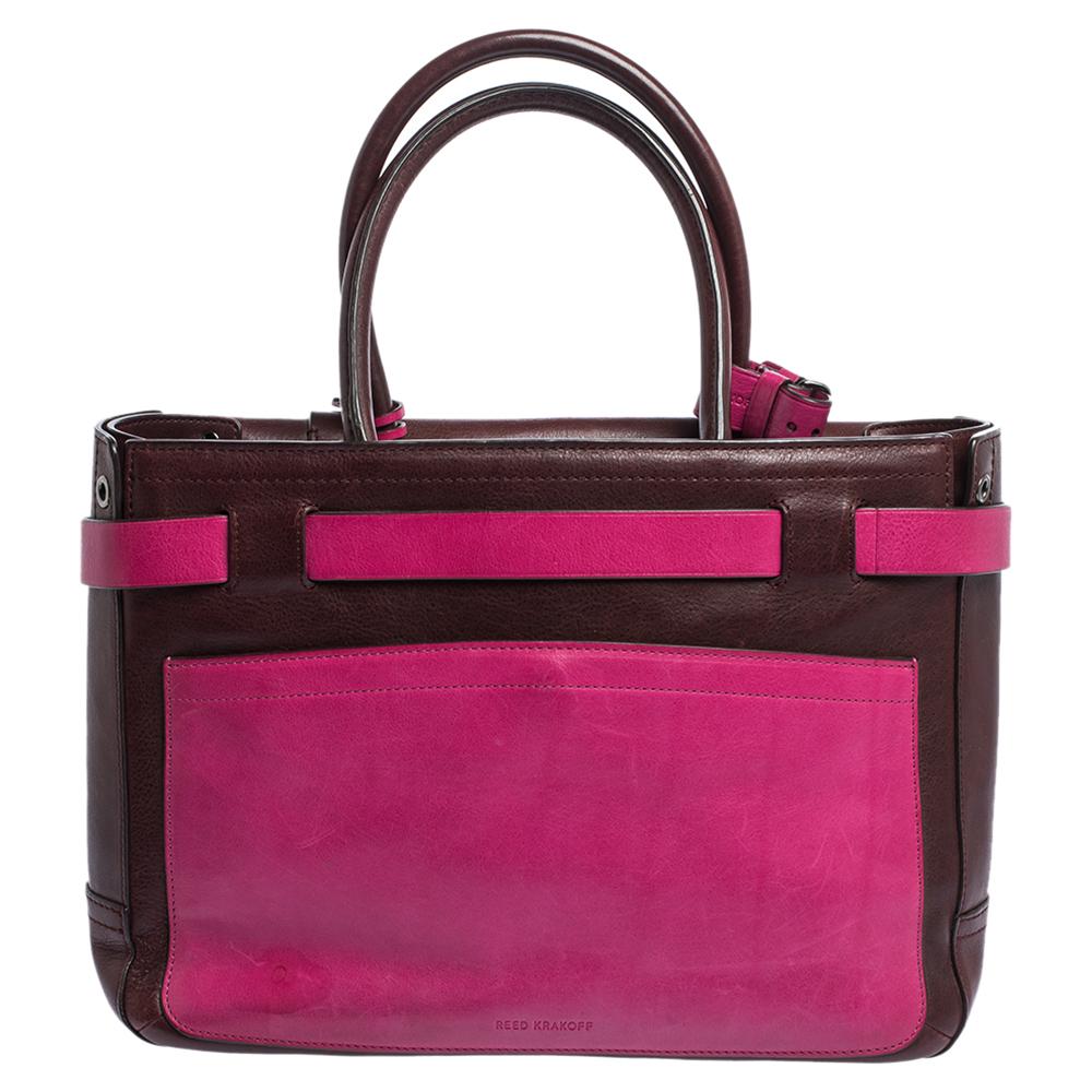 This Reed Krakoff Boxer tote features belt detailing at the front and is crafted from Multicolor Leather. It is equipped with dual rolled handles, buckles and a Fabric-lined interior that has enough space to hold all your daily