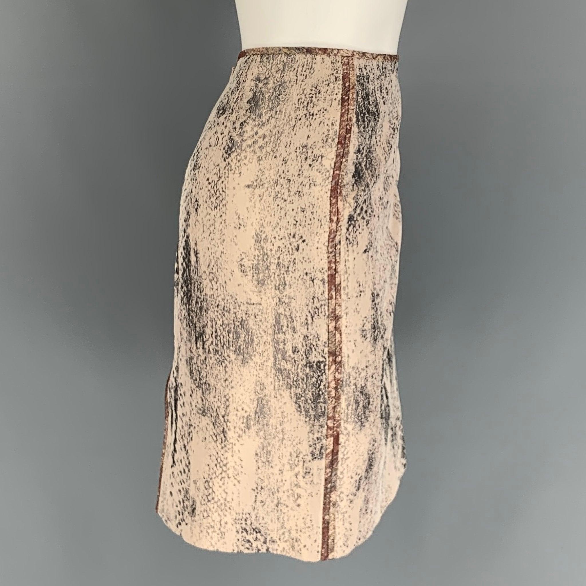 REED KRAKOFF skirt comes in a pink & silver marbled jacquard silk / viscose with a slip liner featuring a pencil style, back slit, and a zipper closure.
Very Good
Pre-Owned Condition. 

Marked:   6 

Measurements: 
  Waist: 32 inches  Hip: 38 inches