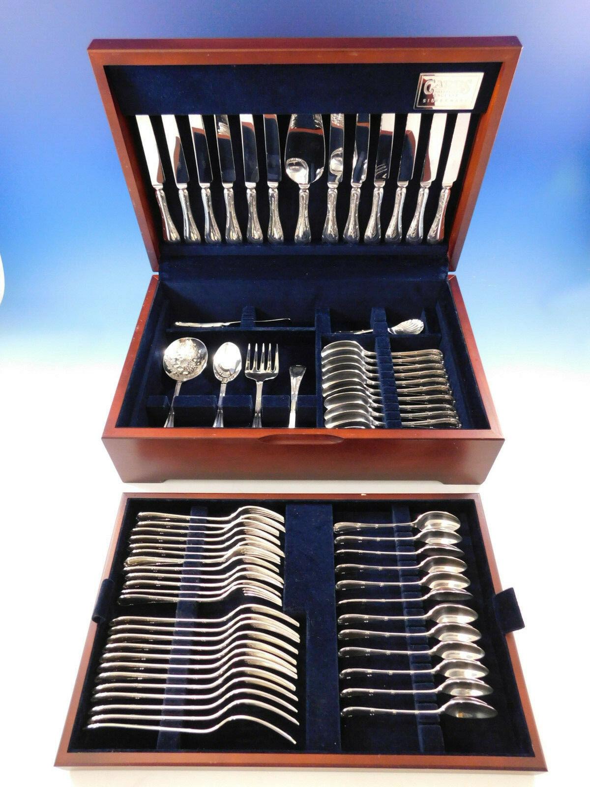 Superb unused dinner size Reed & Ribbon by Carrs England sterling silver flatware set, 67 pieces. Accented with a double reed, ribbon border and bow detail, this pattern displays classic elegance. This set includes:

12 dinner size knives, 10