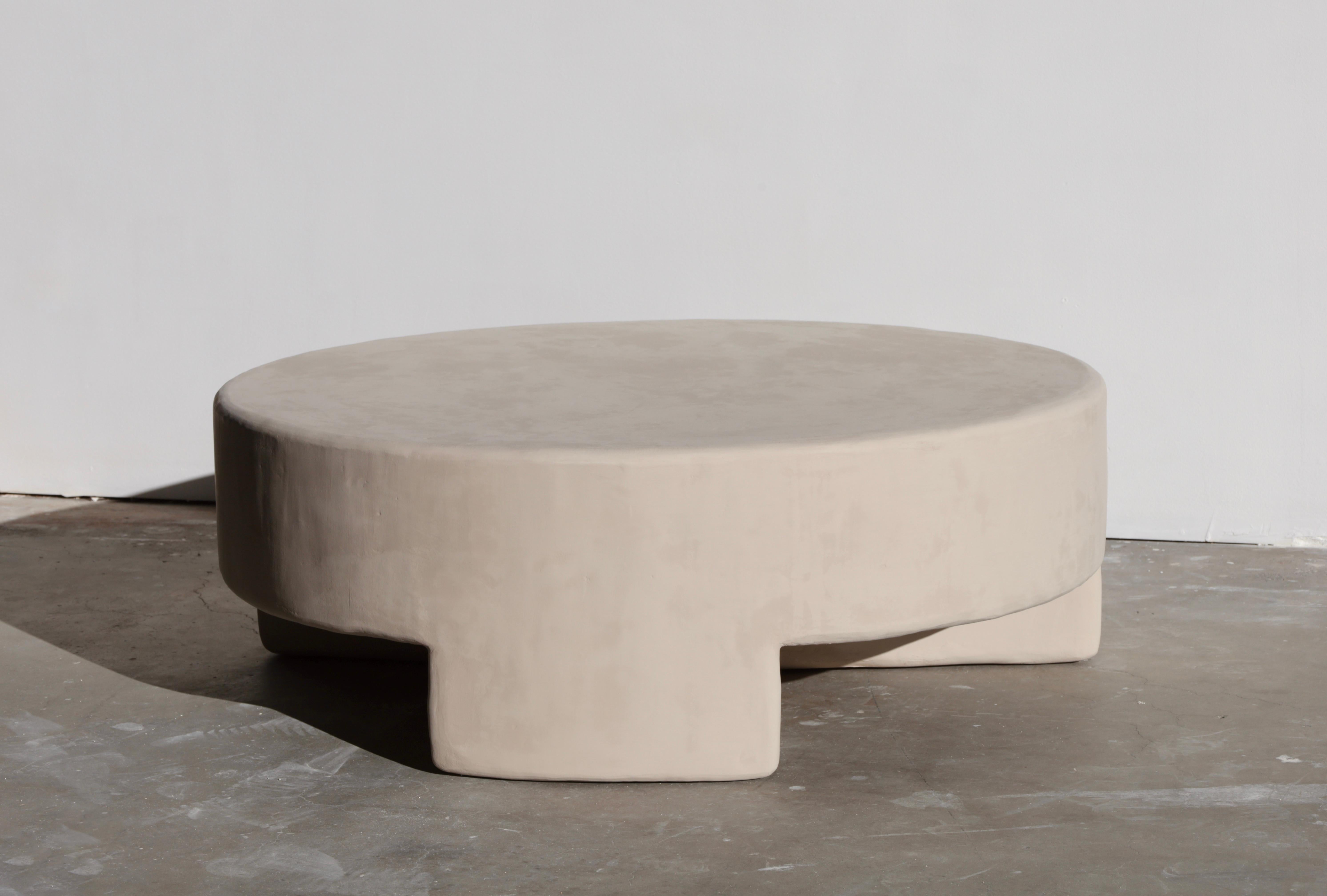 vintage-inspired, incredibly versatile round coffee table that makes great addition to your living and entertaining area. featured in gobi color.

each öken house studio piece is handmade & made to order by a small team of plaster artisans and we