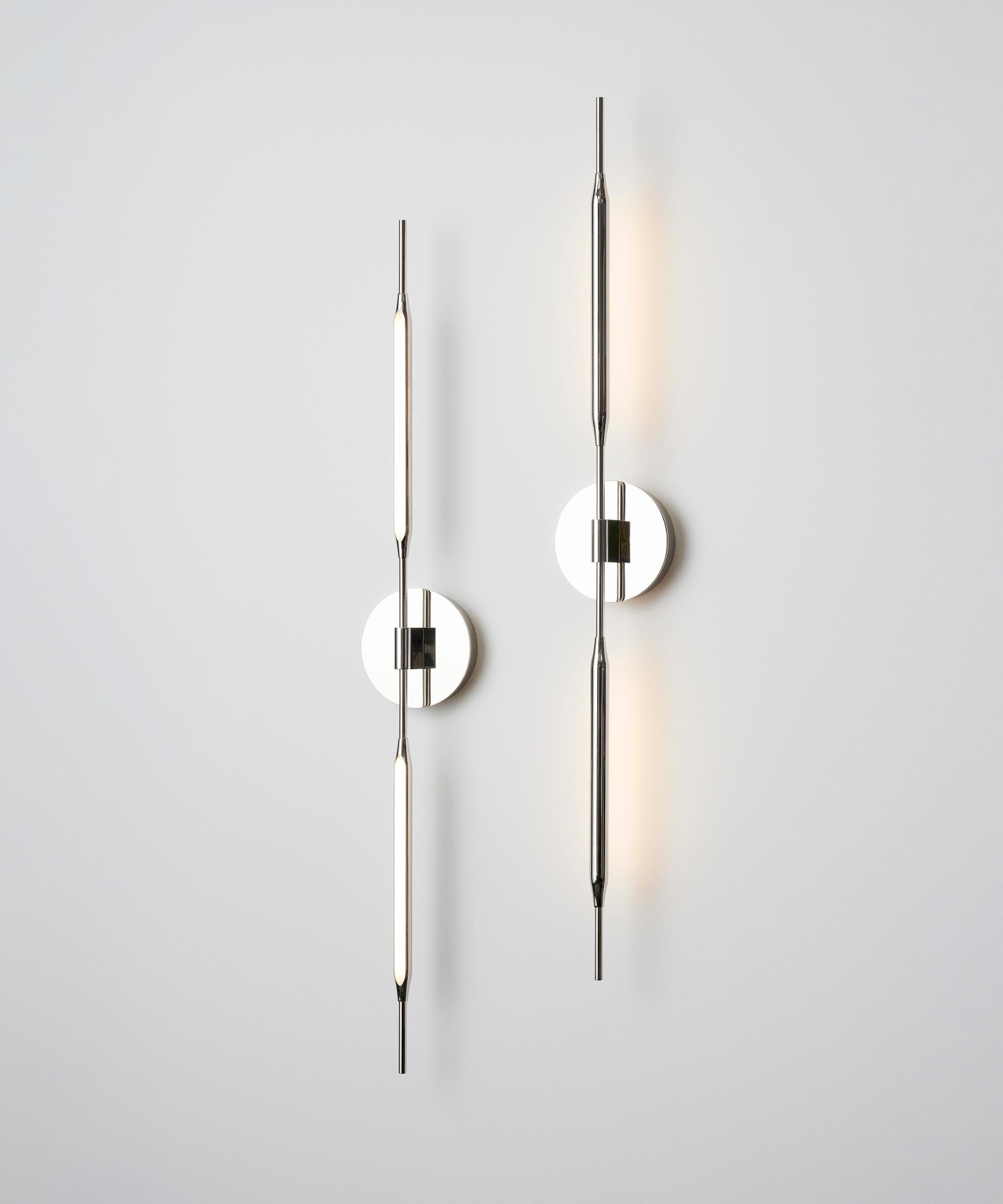 Inspired by slender, natural forms, the Reed Wall Lights are designed to deliver soft accents to an interior lighting scheme. Used in conjunction with the Reed portable luminaires, their versatility combines with a unique aesthetic. Precision