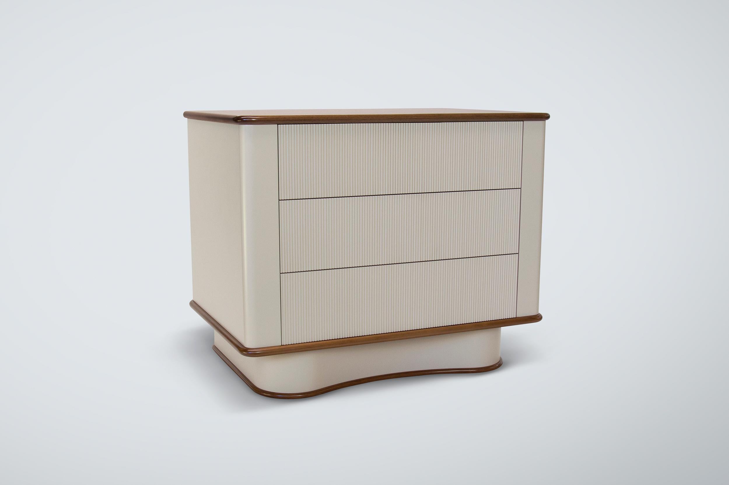Our Bancroft bedside table shown in warm walnut with satin lacquer.