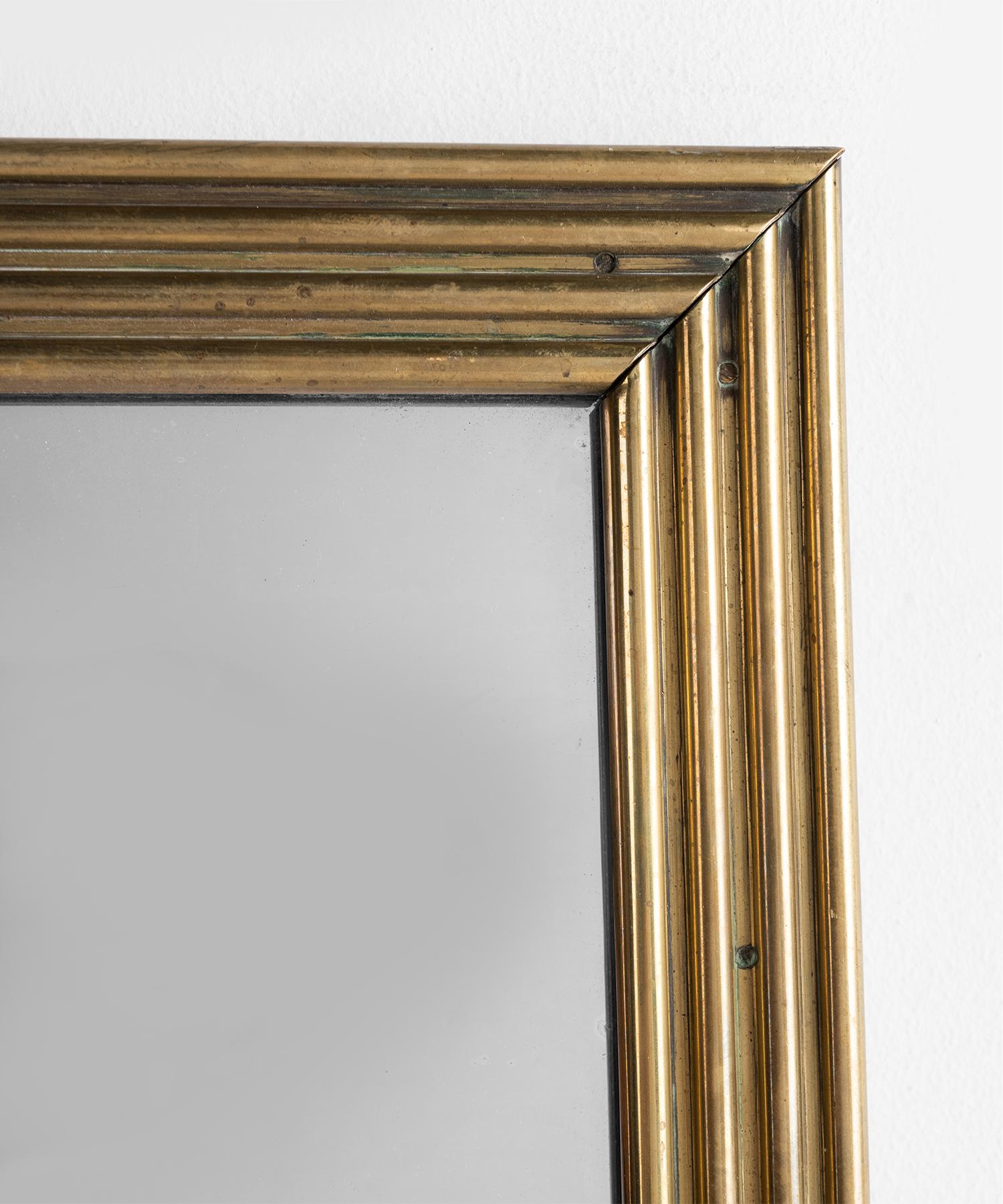 Reeded brass frame bistro mirror, Italy circa 1930.

Wonderful size with beautiful, decorative frame.