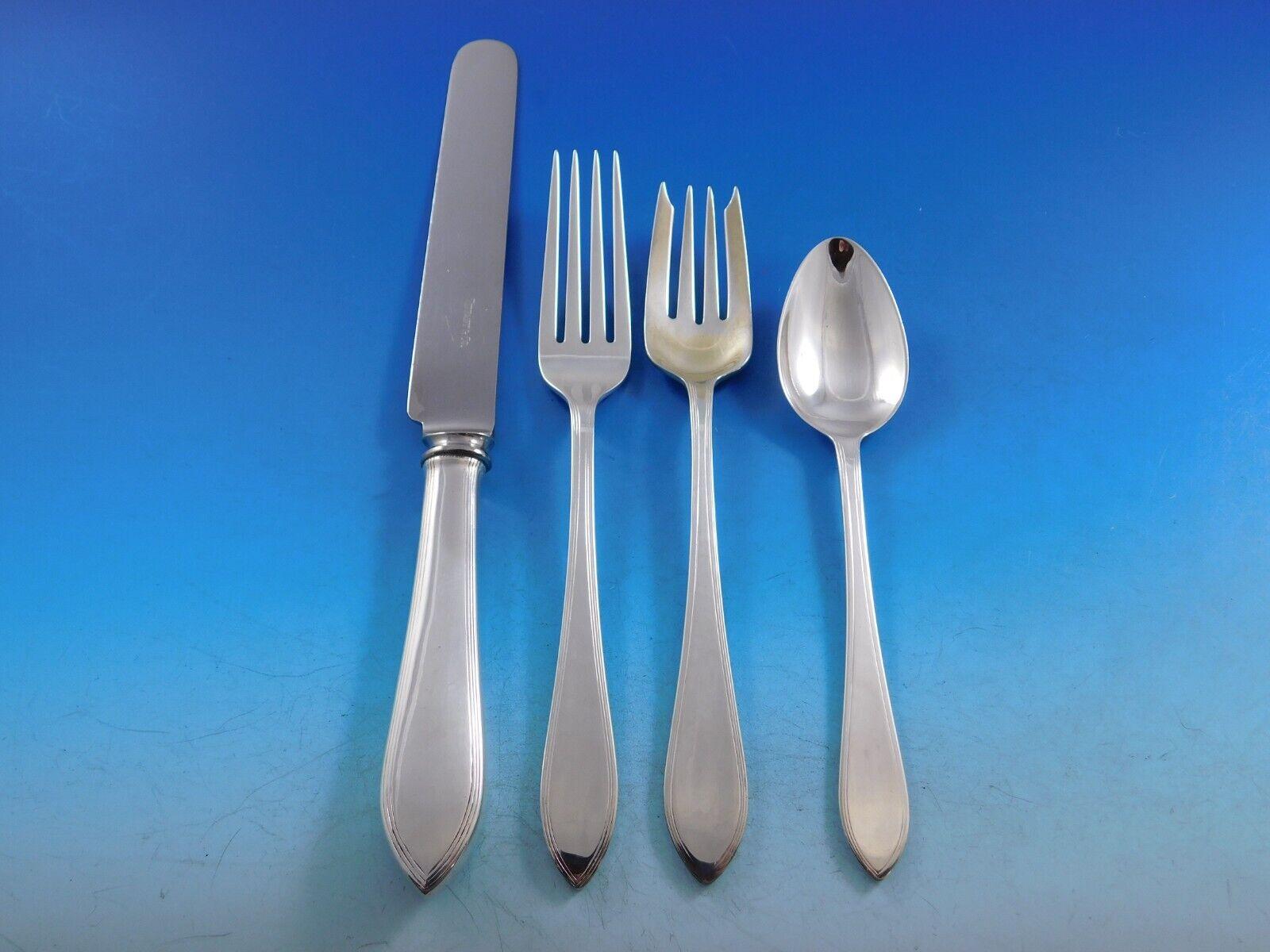 Reeded Edge by Tiffany and Co. sterling silver Flatware set, 101 pieces. This pattern was introduced by Tiffany in the year 1937 and features a classic timeless Queen Anne design with a stamped reeded border. This set includes:

8 Regular Knives