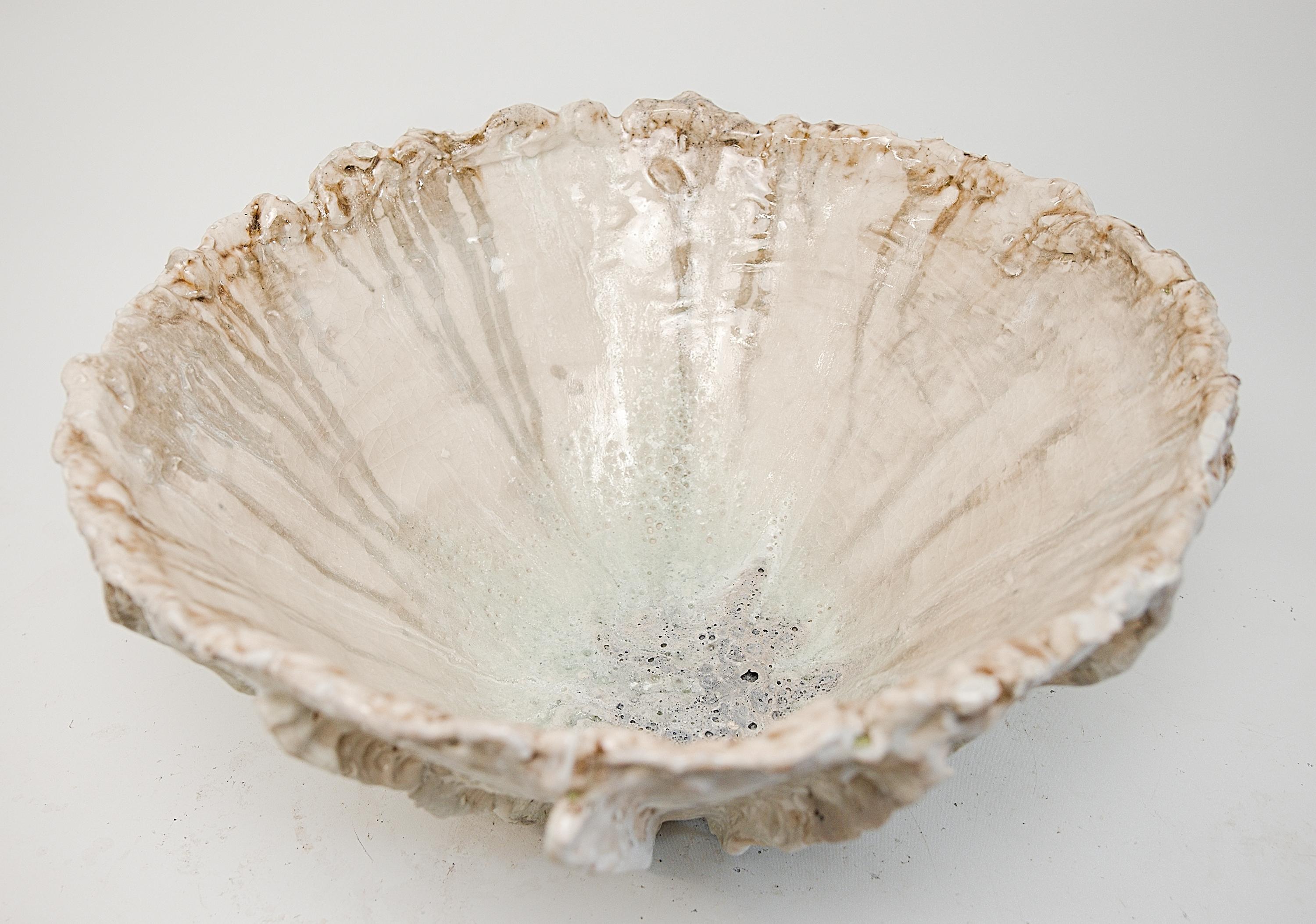 Discover the Sculptural Reef Large Low Stoneware Planter Bowl, the perfect large sized bowl to use as a planter for orchids or other succulents on your table. This exquisite piece is handcrafted from stoneware clay and adorned with a crackle matte