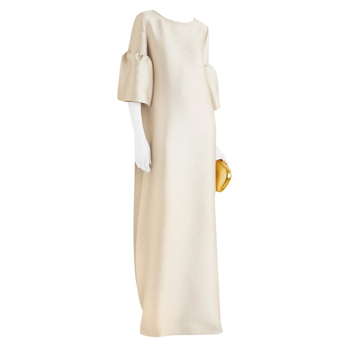 Reem Acra Beige Long Sleeve Midi Dress 

-Made of a lightweight satin pique fabric 
-Classic elegant cut 
-Loose fit 
-Ruffled flared sleeves 
-Gorgeous sand hue 
-Timeless neutral design 

Materials:
100% polyester 

Dry clean only 

PLEASE NOTE -