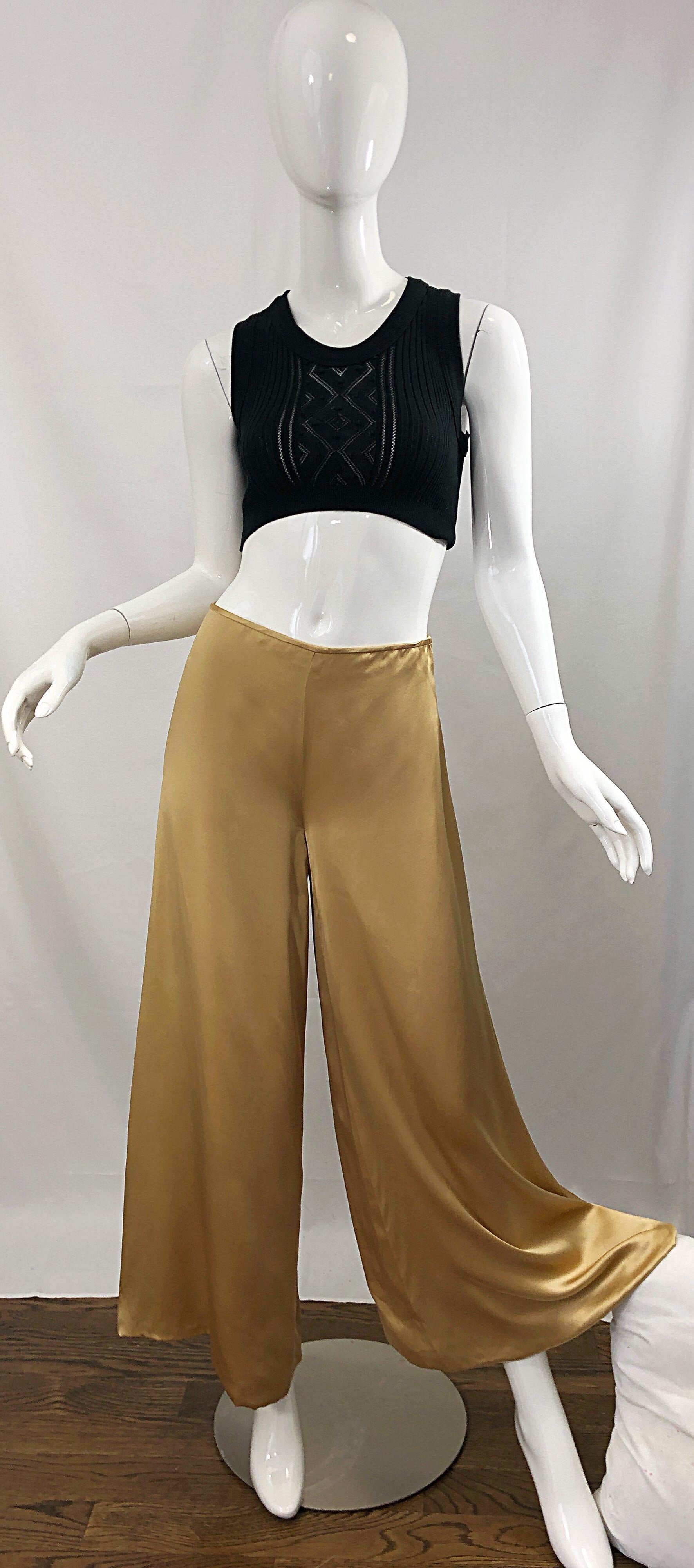 Insanely chic early 2000s REEM ACRA liquid gold silk wide leg trousers! Fine luxurious silk that moves like liquid. Long wide legs elongate the body. Hidden zipper up the side with hook-and-eye closure. The perfect alternative to a skirt! Super