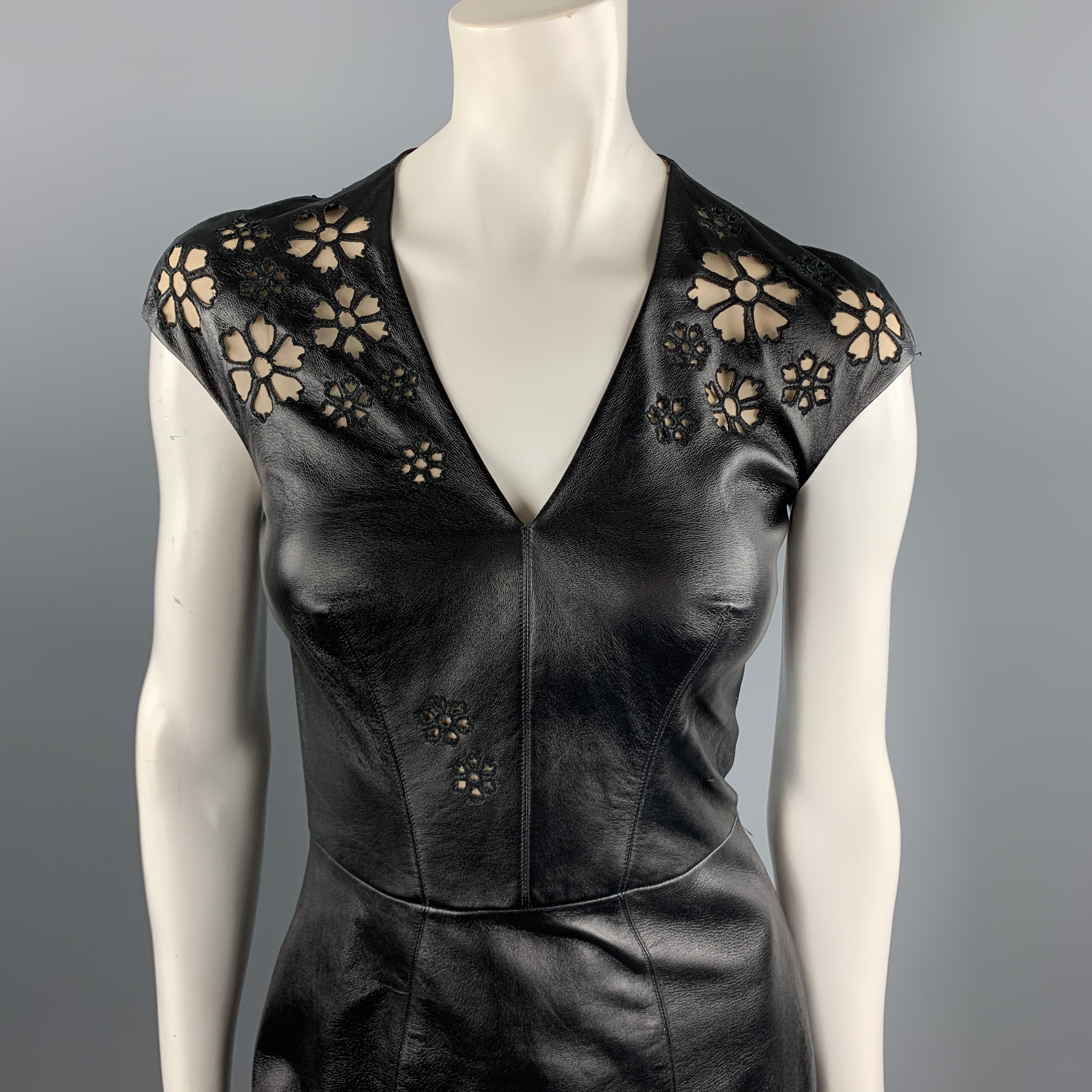 REEM ACRA circa 2012 shift dress comes in black leather with tan silk liner, V neck, and floral cutouts. 

New with Tags.
Marked: 4

Measurements:

Shoulder: 18 in.
Bust: 34 in.
Waist: 26 in.
Hip: 34 in.
Length: 43 in.