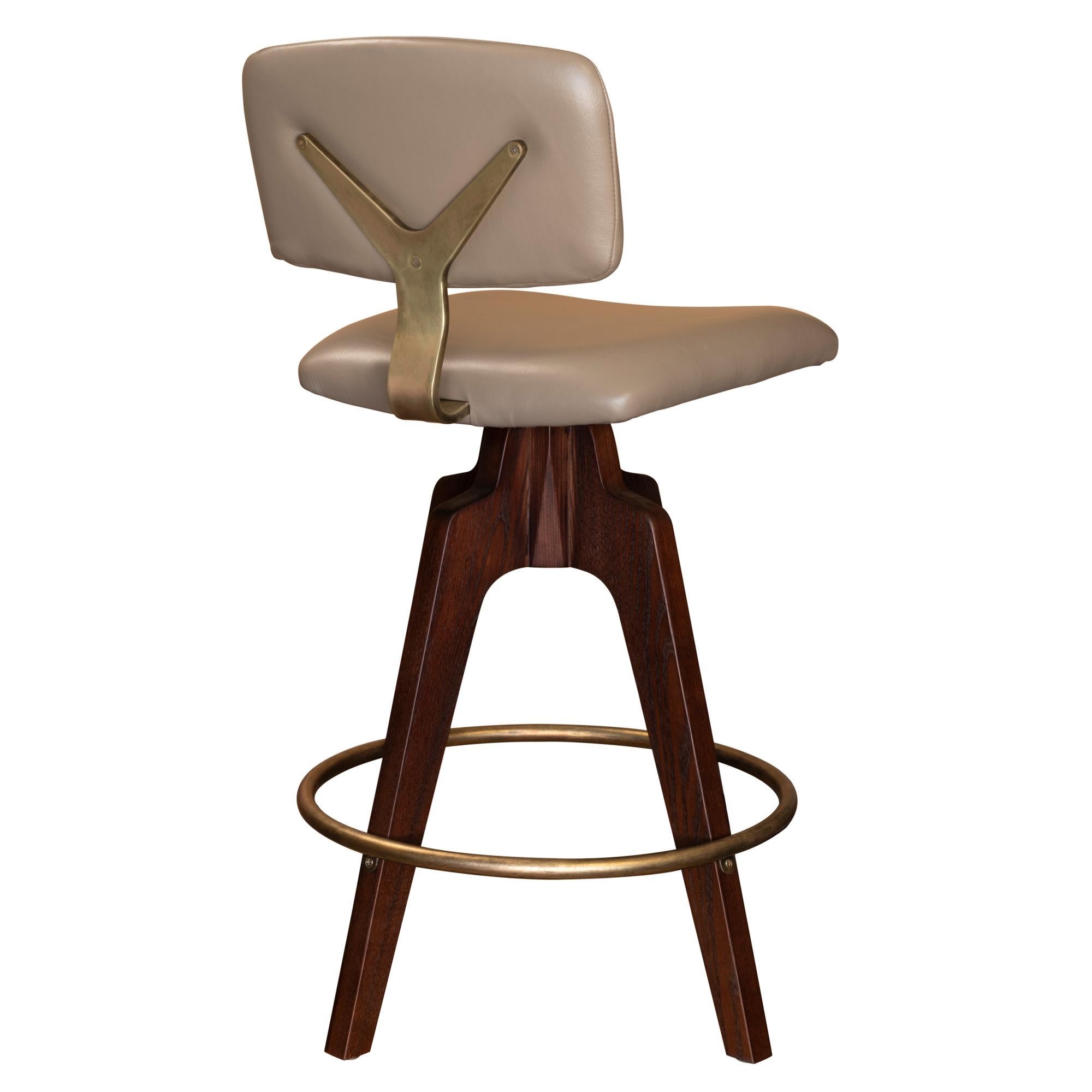 Metal Reeves Swivel Bar Stool W/ Ash legs stained Walnut, Leather & Brass Finish.  For Sale